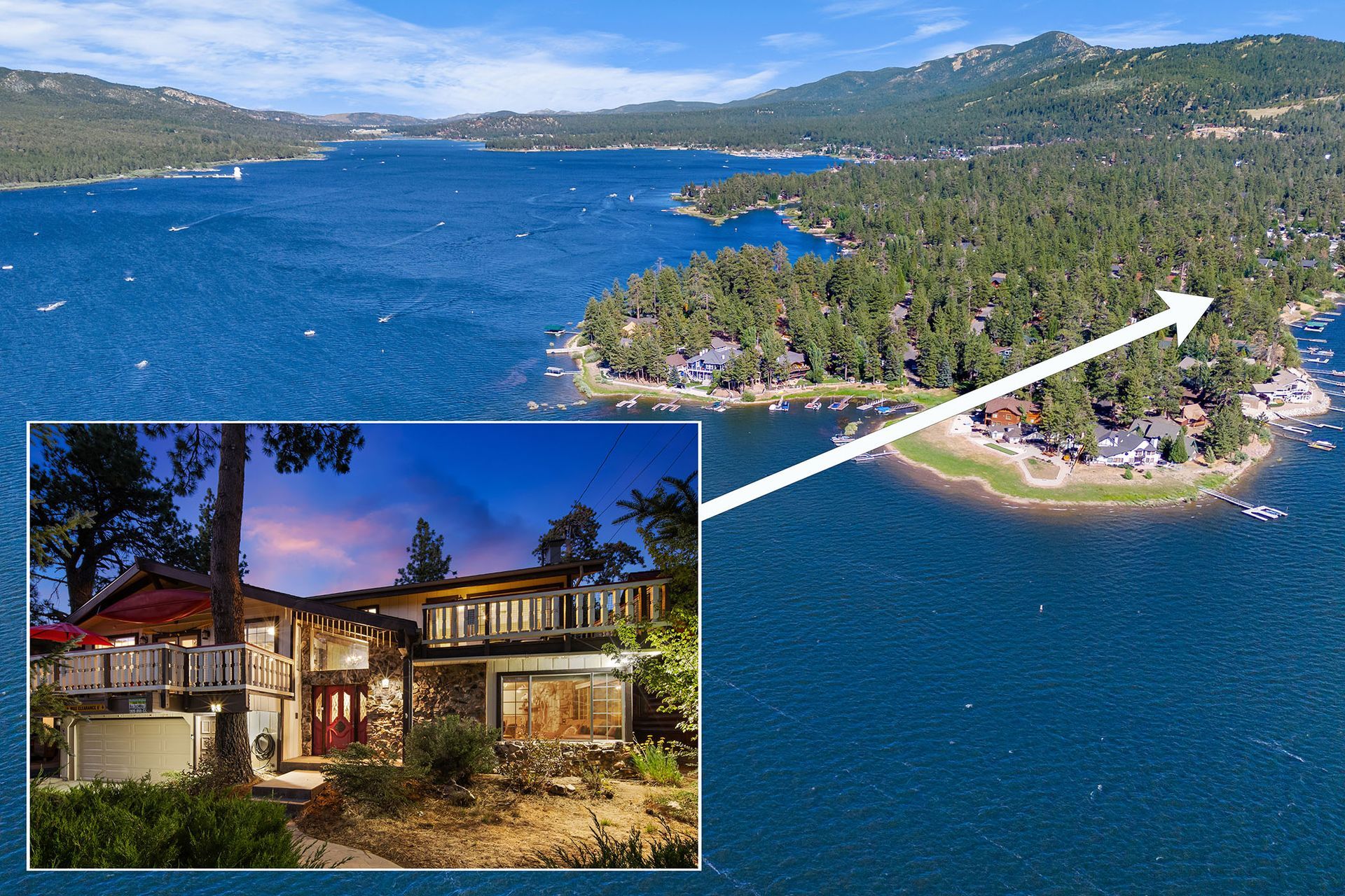 An aerial view of a house on a small island in the middle of a lake