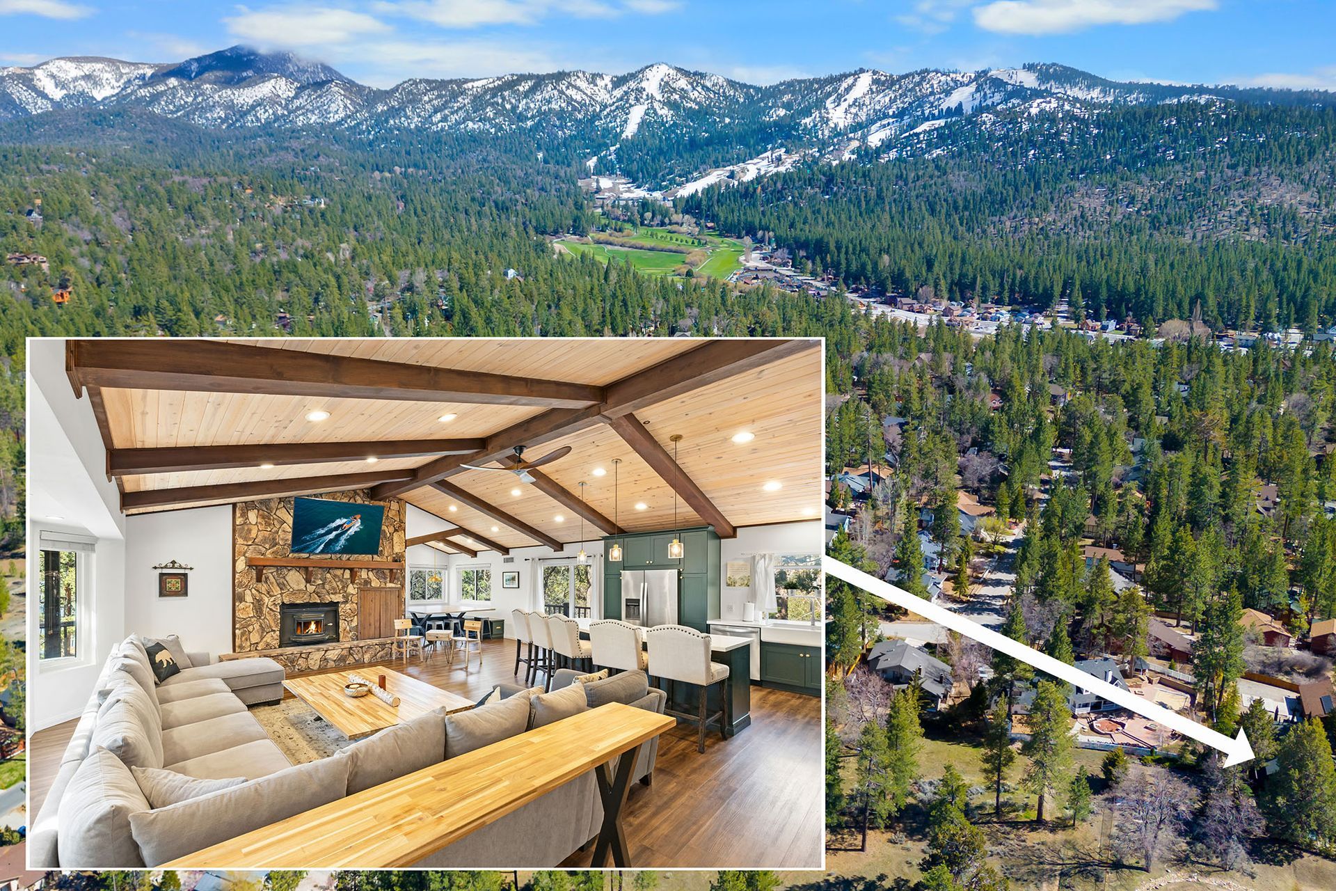 An aerial view of a living room with a fireplace and a mountain in the background.