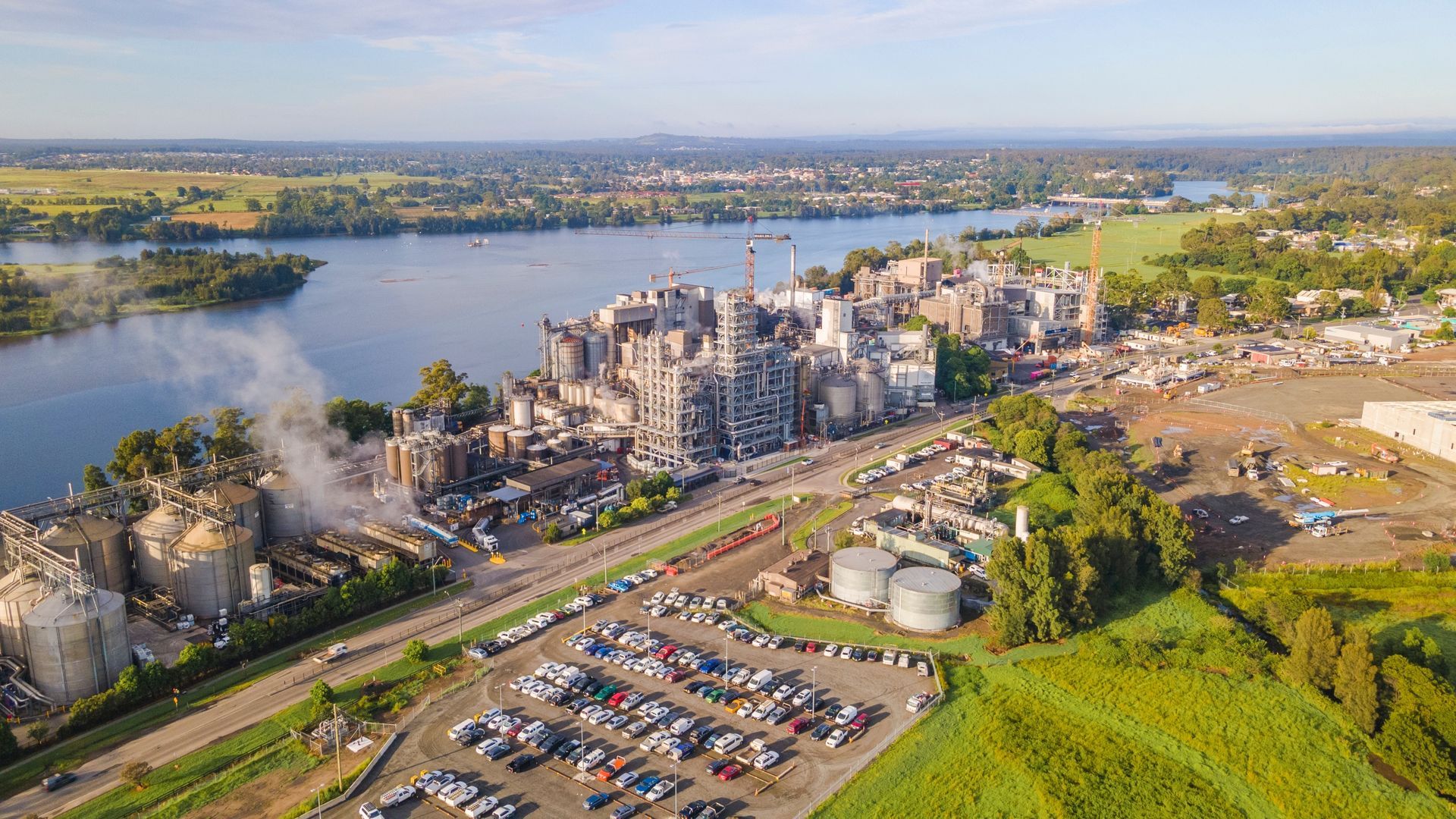 An Aerial View Of A Factory Next To A Lake — Keany's Electrical Service In Bomaderry, NSW