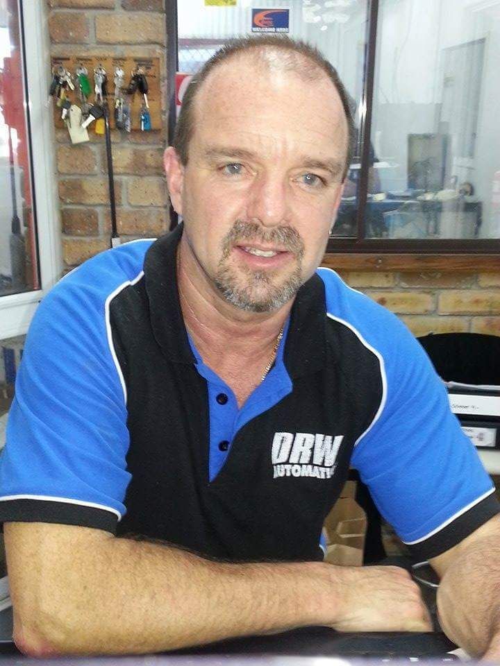 A person is changing gears in a car.