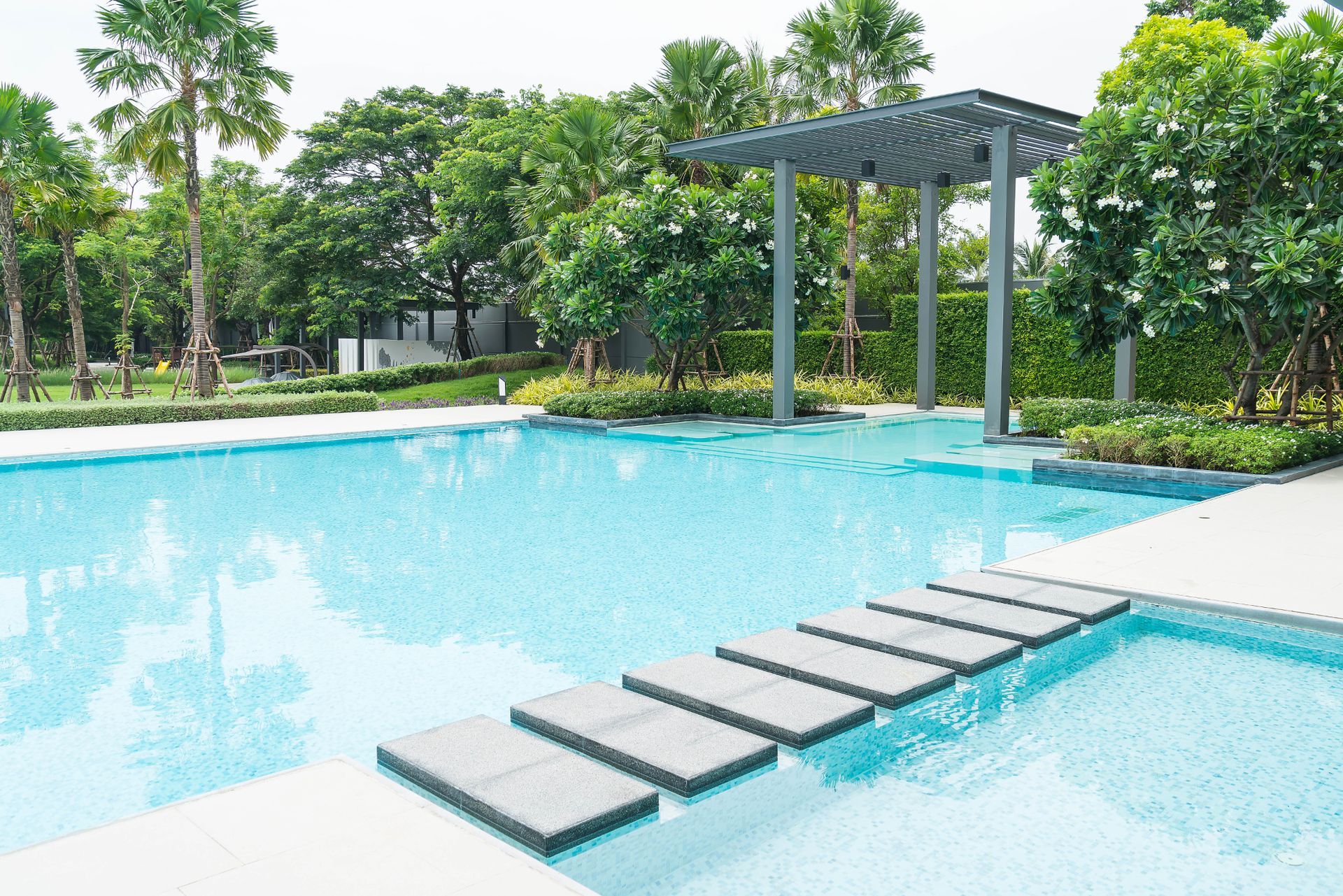 A large swimming pool with steps leading to it