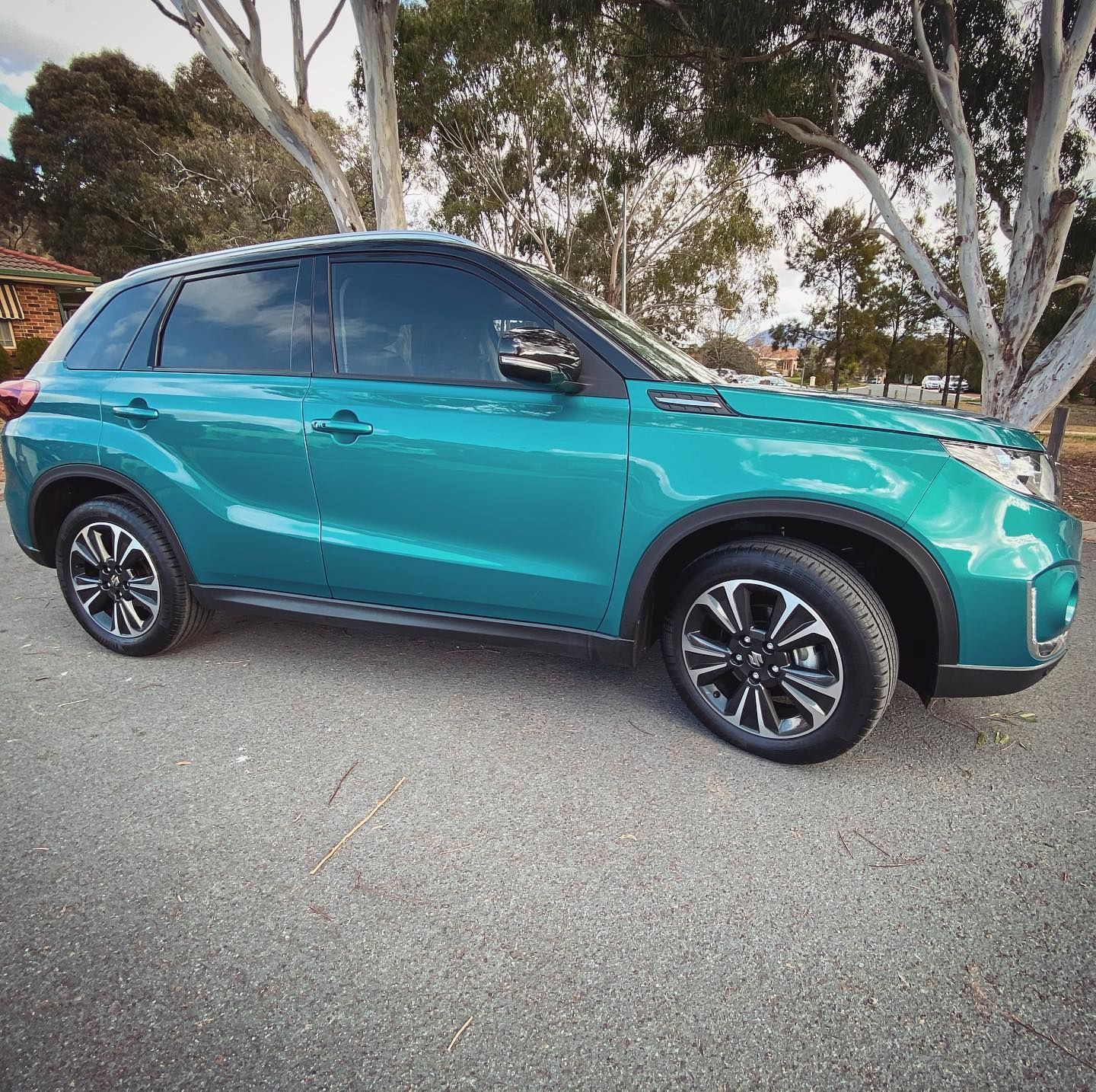 A Blue Car is Parked on the Side of the Road — Diamond Tints In Weston Creek, ACT