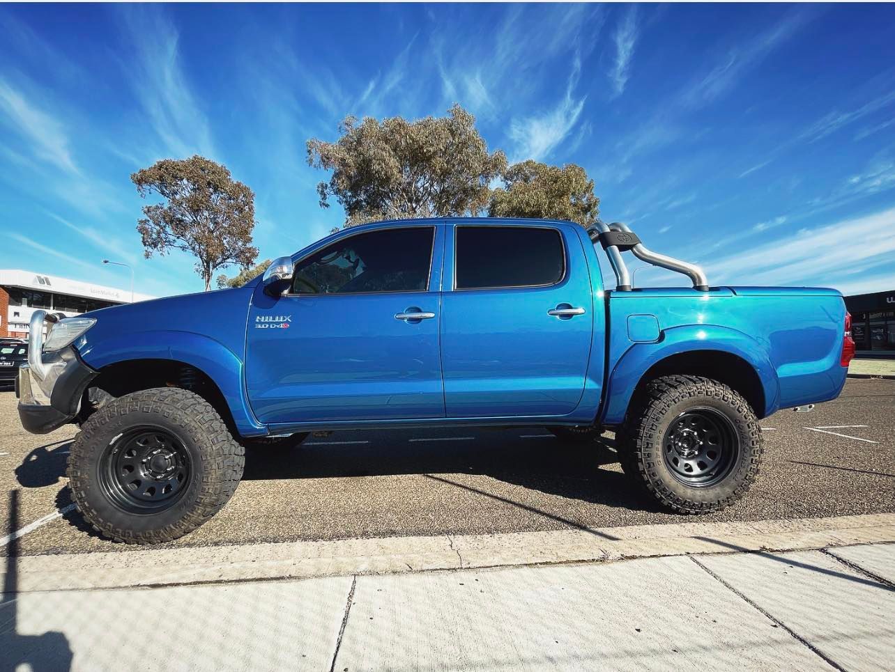 A Blue Truck is Parked on the Side of the Road — Diamond Tints In Phillip, ACT