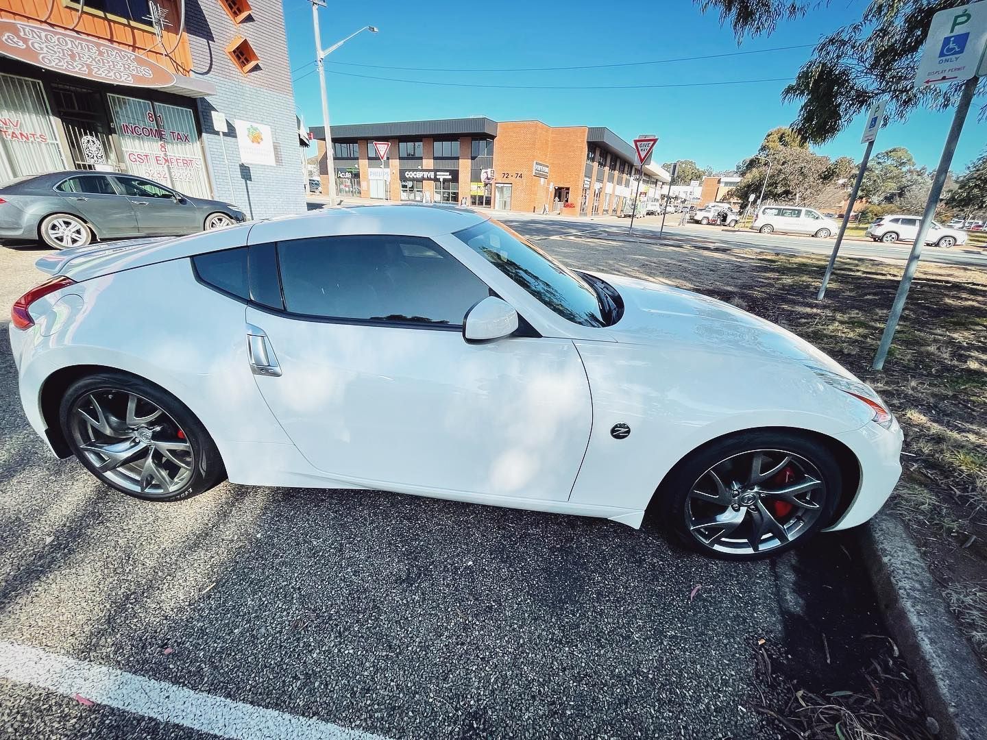 A White Sports Car is Parked in a Parking Lot — Diamond Tints In Phillip, ACT