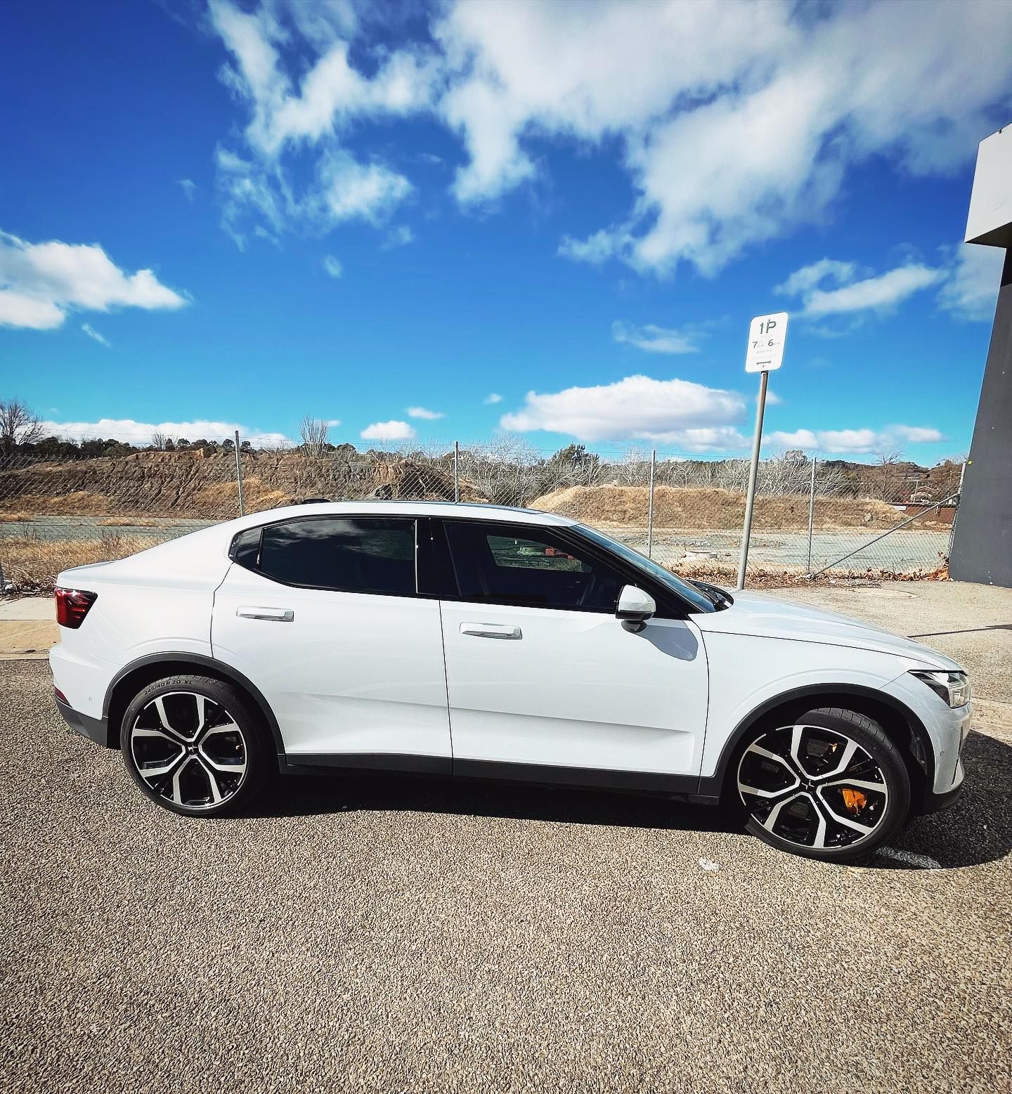 A White Car is Parked in a Parking Lot on a Sunny Day — Diamond Tints In Phillip, ACT