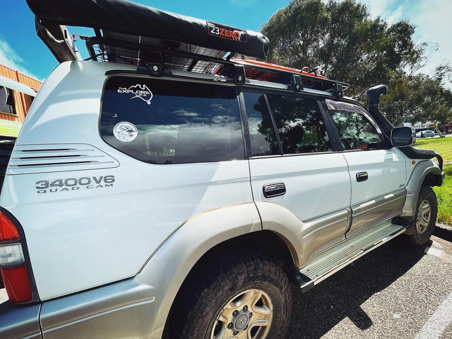 A Silver SUV is Parked on the Side of the Road — Diamond Tints In Phillip, ACT