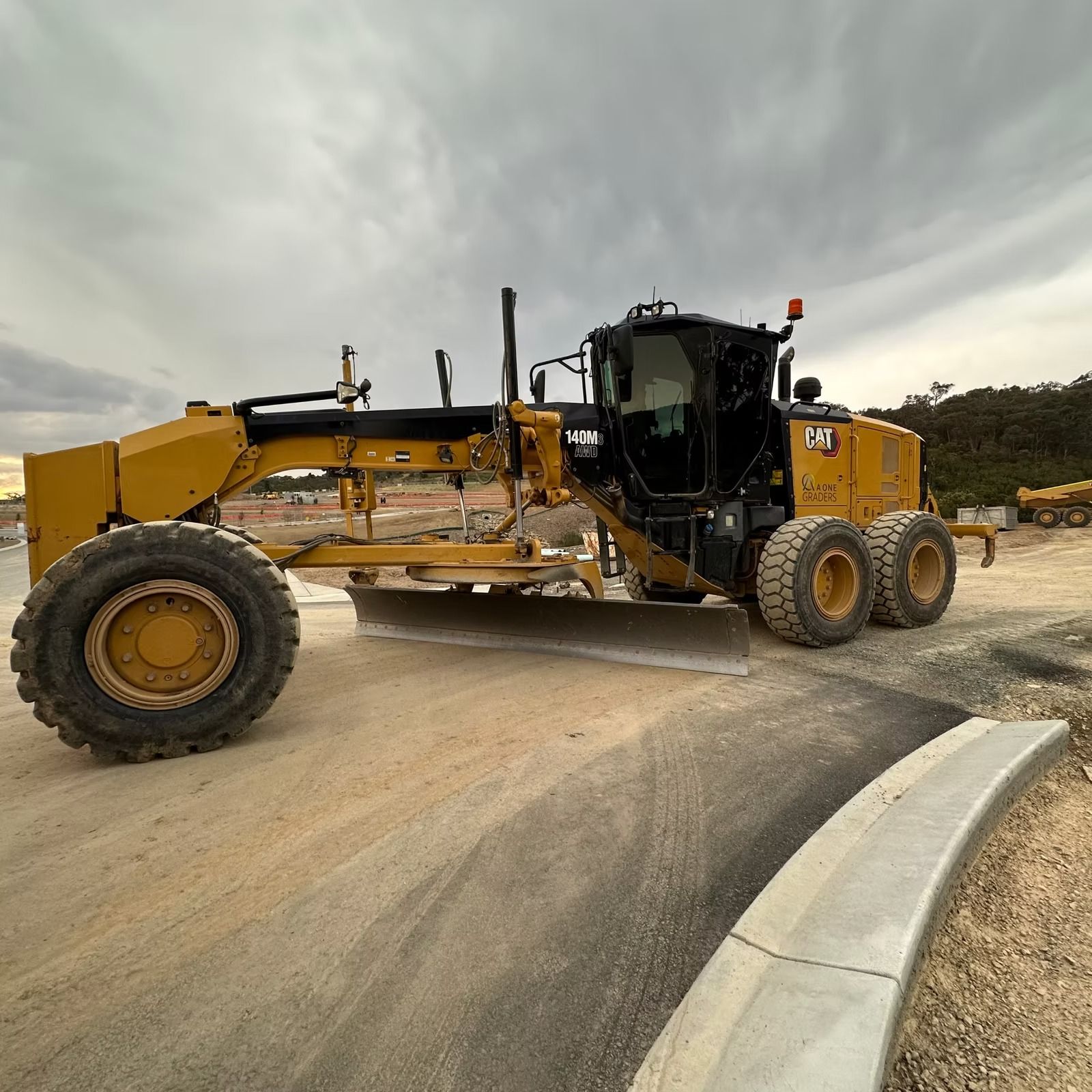 A Yellow tractor is Working on a Construction Site — Diamond Tints In Goulburn, ACT