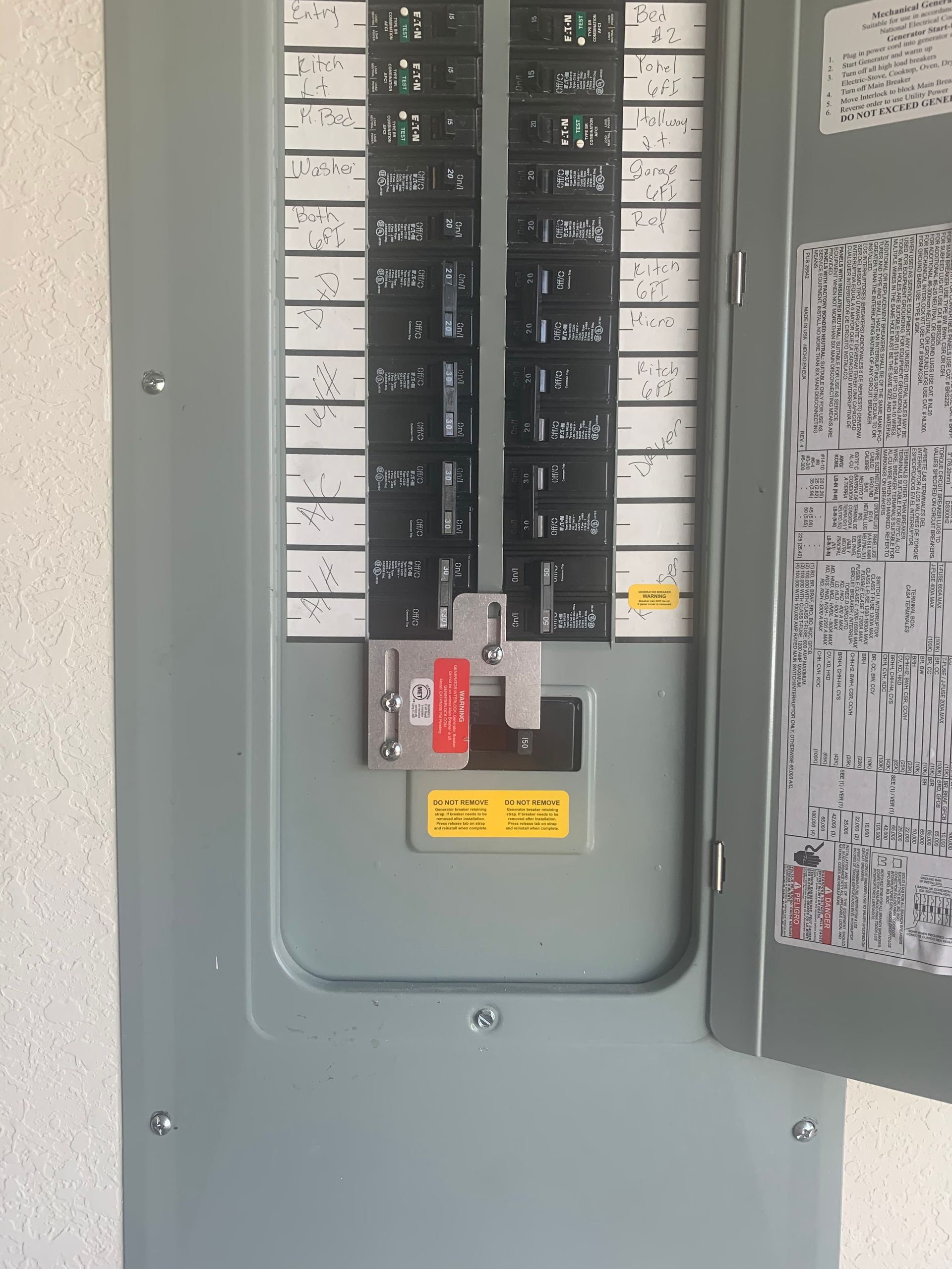 A close up of a electrical panel on a wall.
