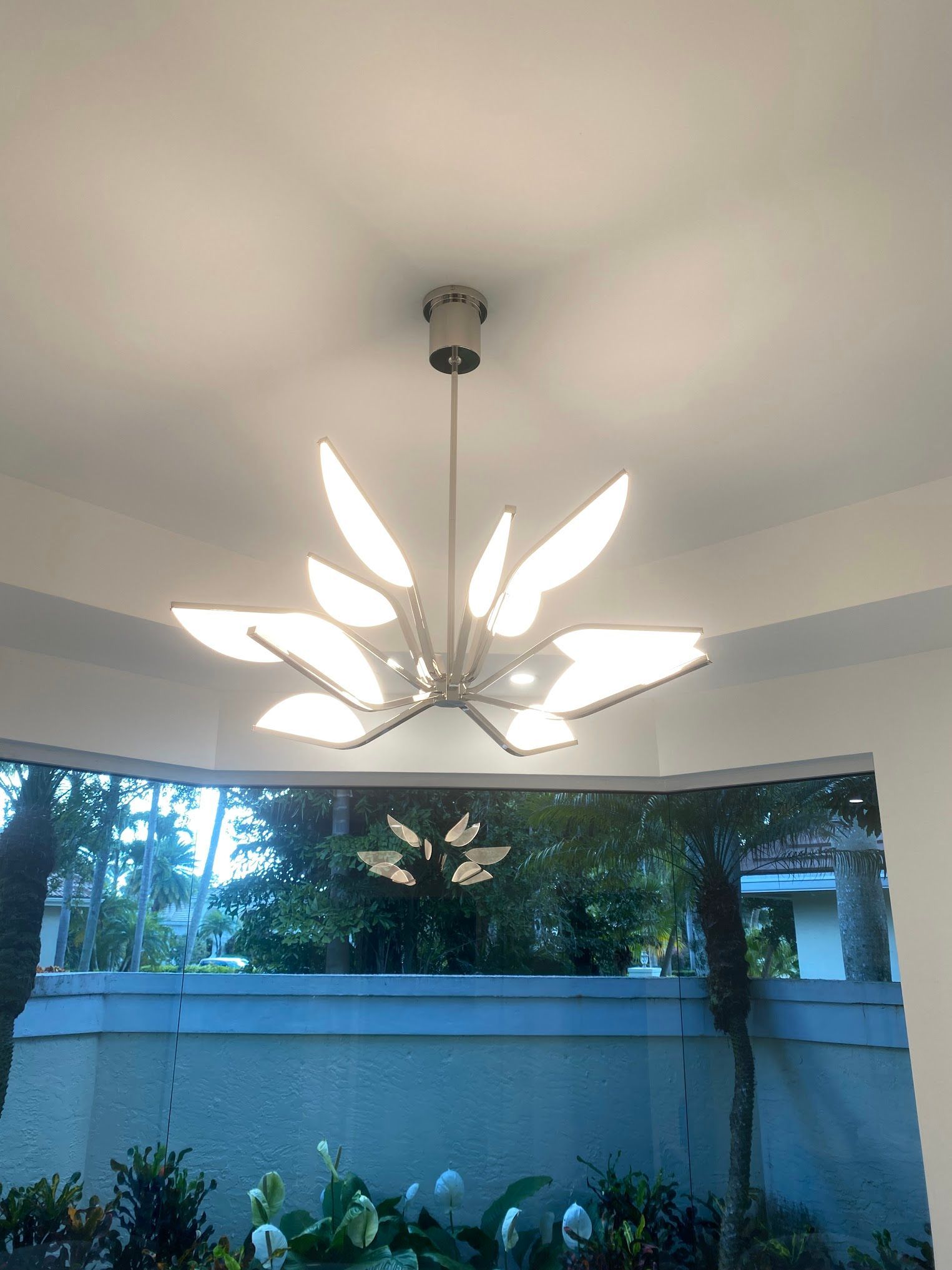 A chandelier is hanging from the ceiling of a room.