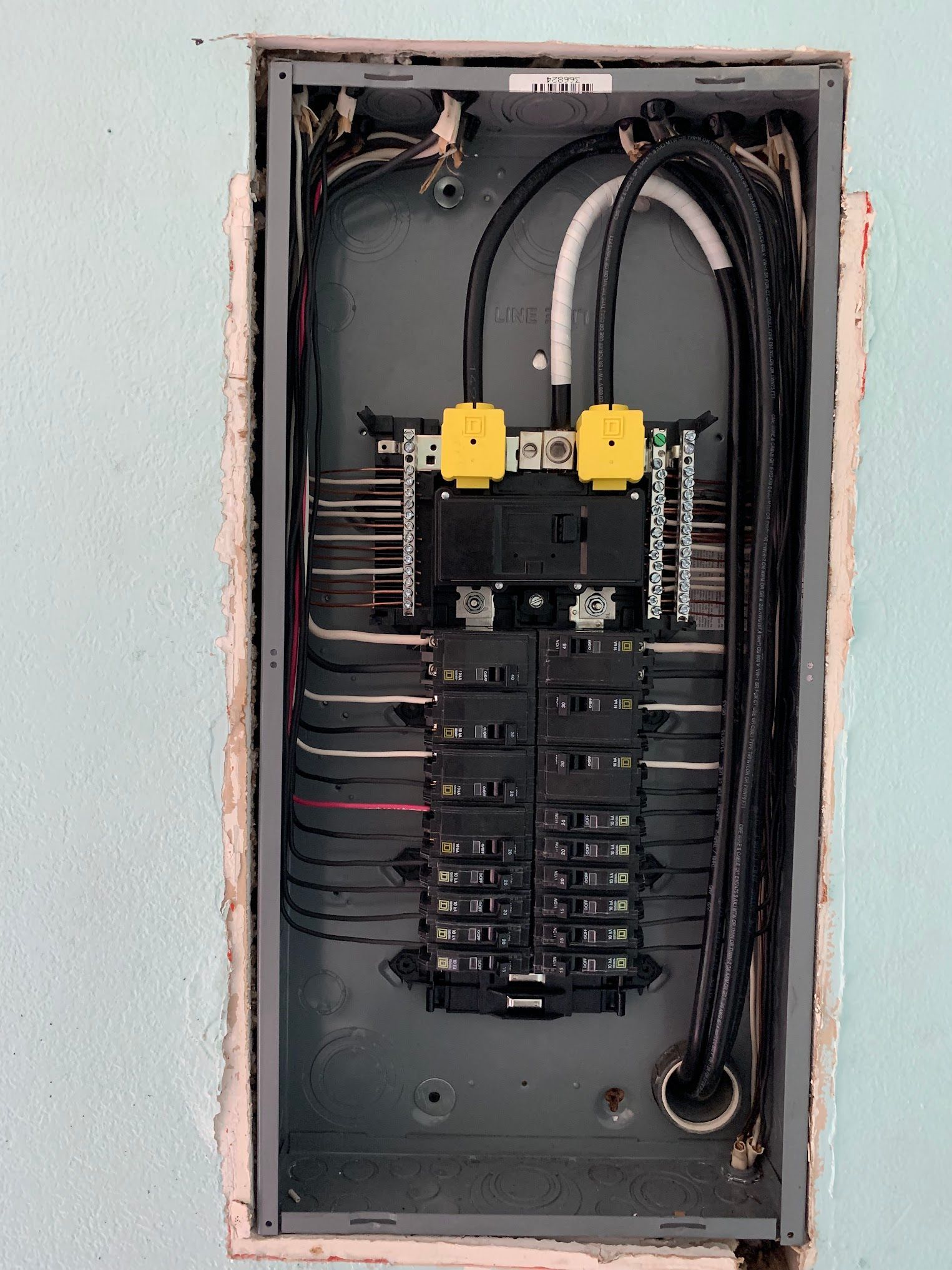 A close up of a electrical panel on a wall.