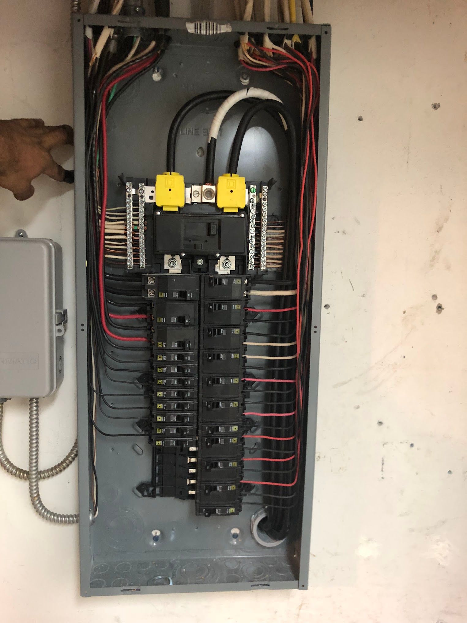 A close up of a electrical panel on a wall.
