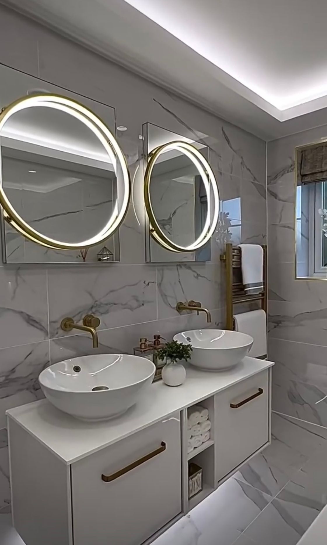 A large black house with stairs leading up to it.