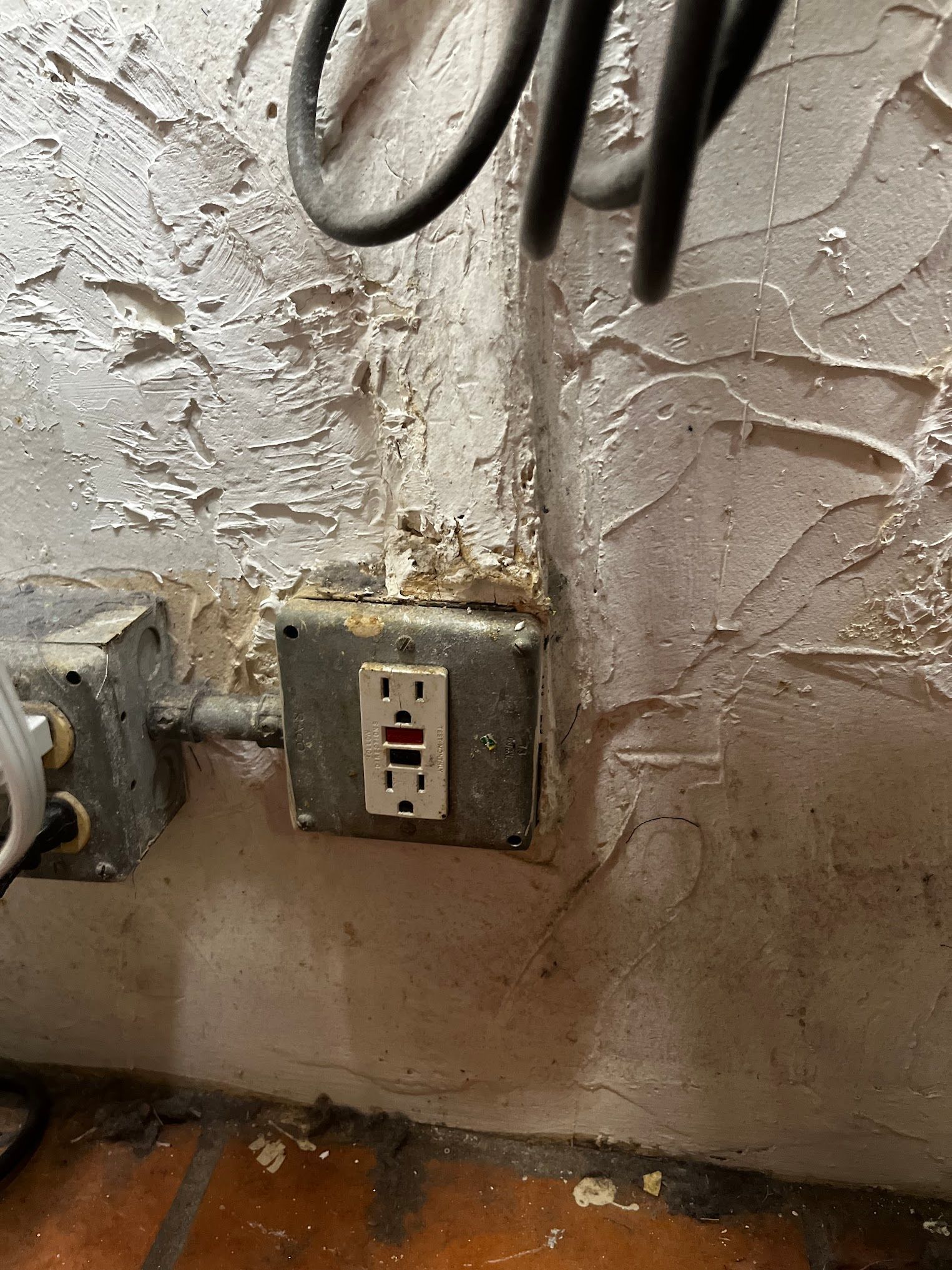 A close up of an electrical outlet on a wall.