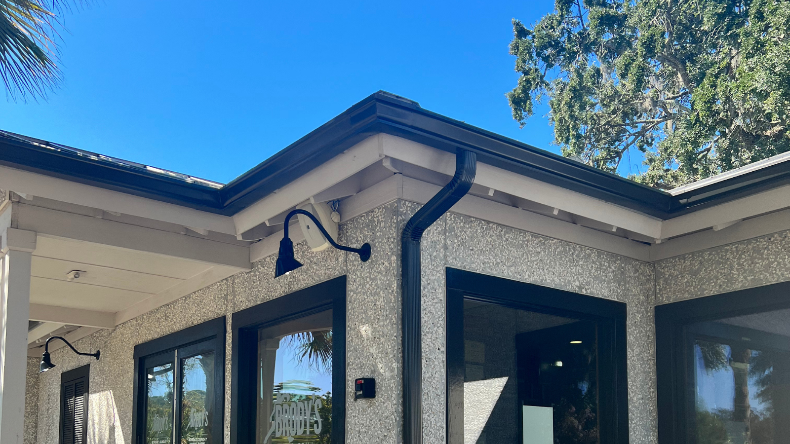 A picture of a house with seamless gutters attached.