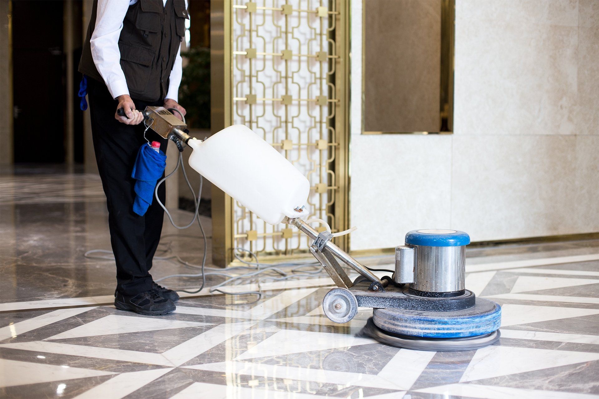 Man Polishing Marble Floor