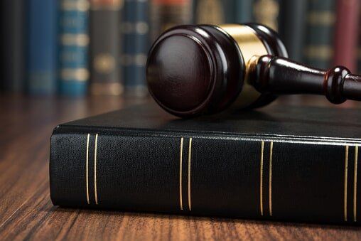 Legal Code And Scales Of Justice - Civil Litigation in Champaign - Urban, IL