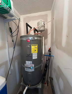 Black River Plumbing & Gas - A. O. Smith water heater in a utility closet.