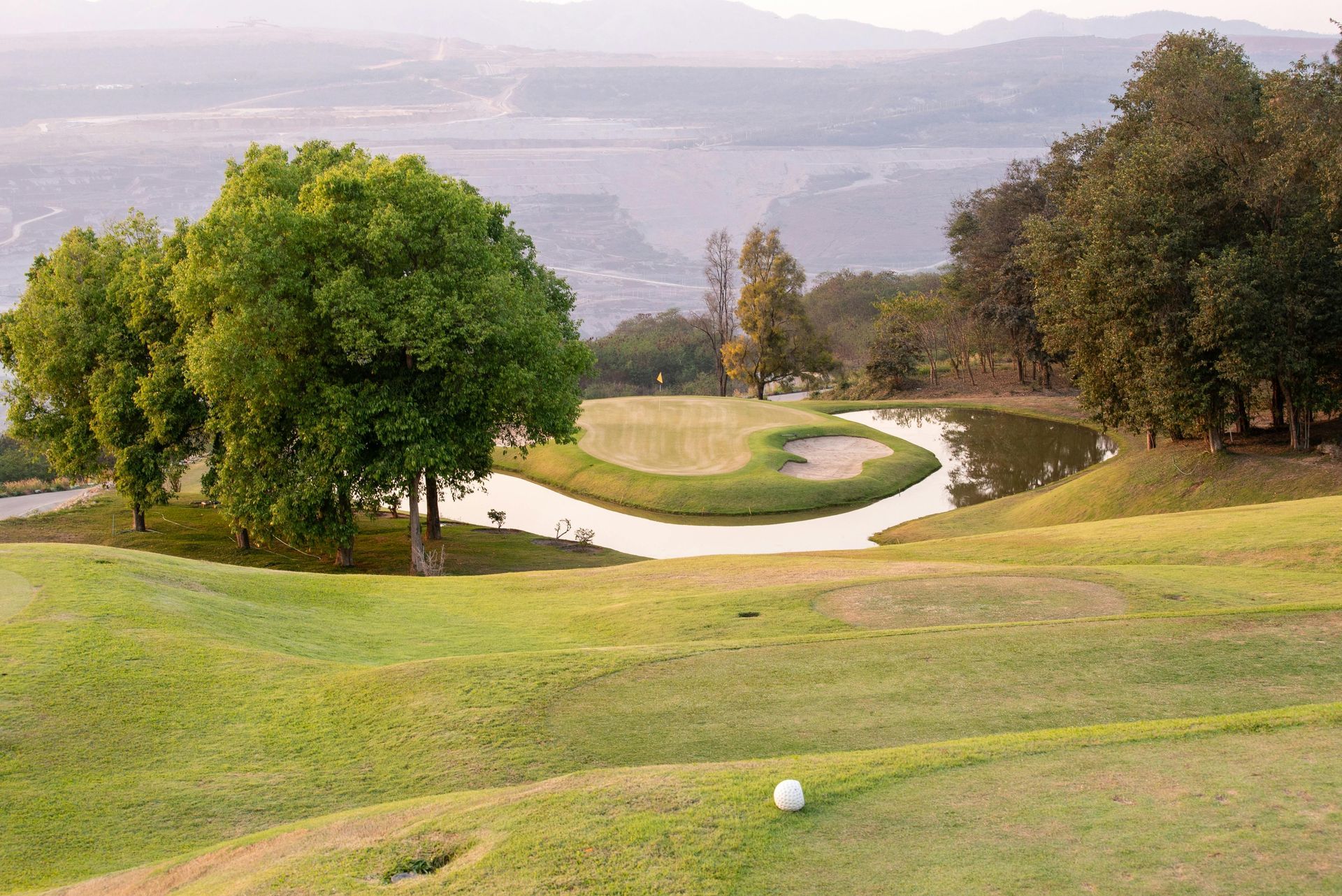 A golf ball is sitting on the green of a golf course.