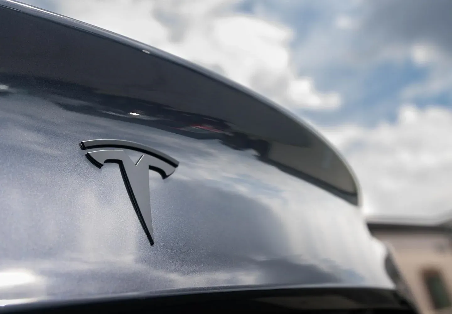 A close up of the back of a tesla model 3.