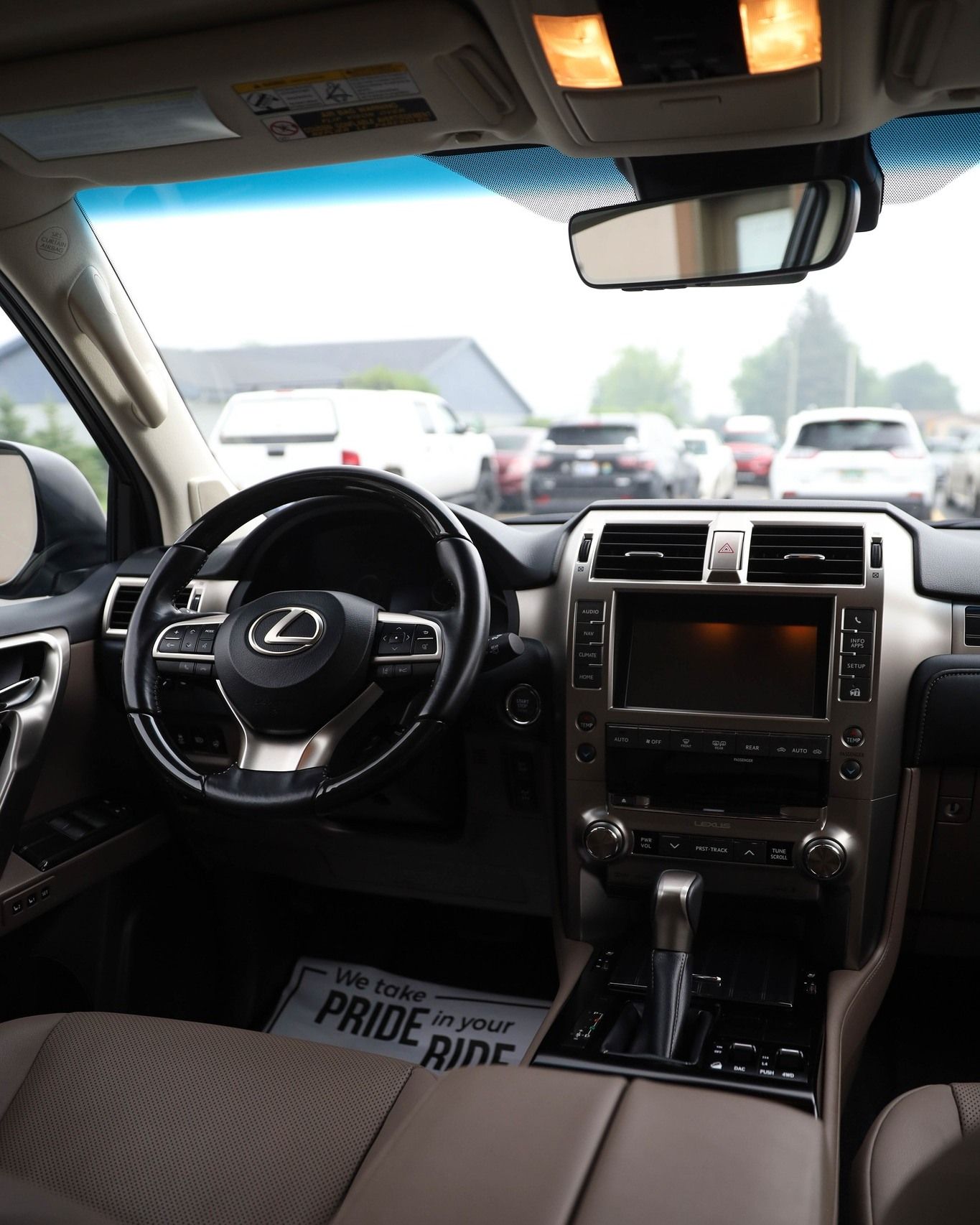 the inside of a lexus car with a paper that says pride ride