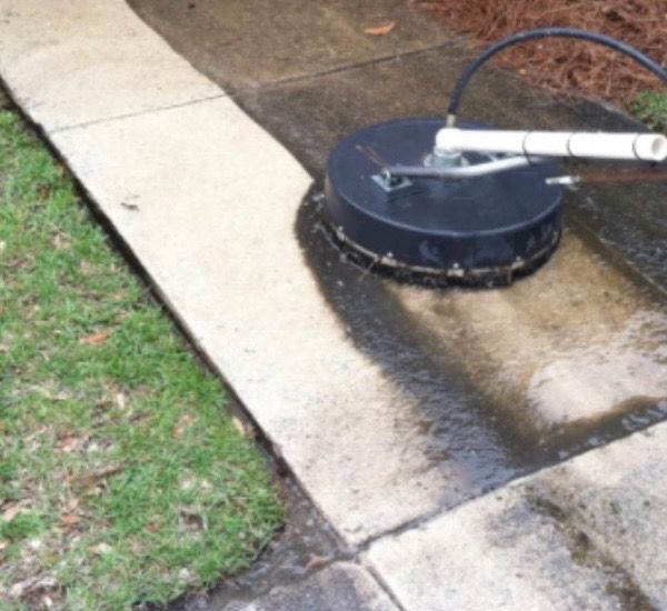 Powerwashing sidewalk