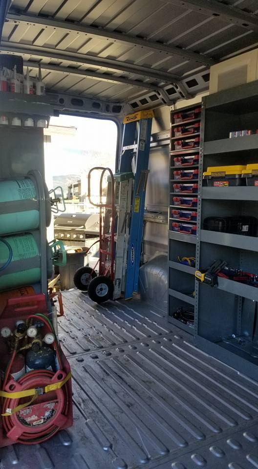 The inside of a van filled with lots of tools and equipment.