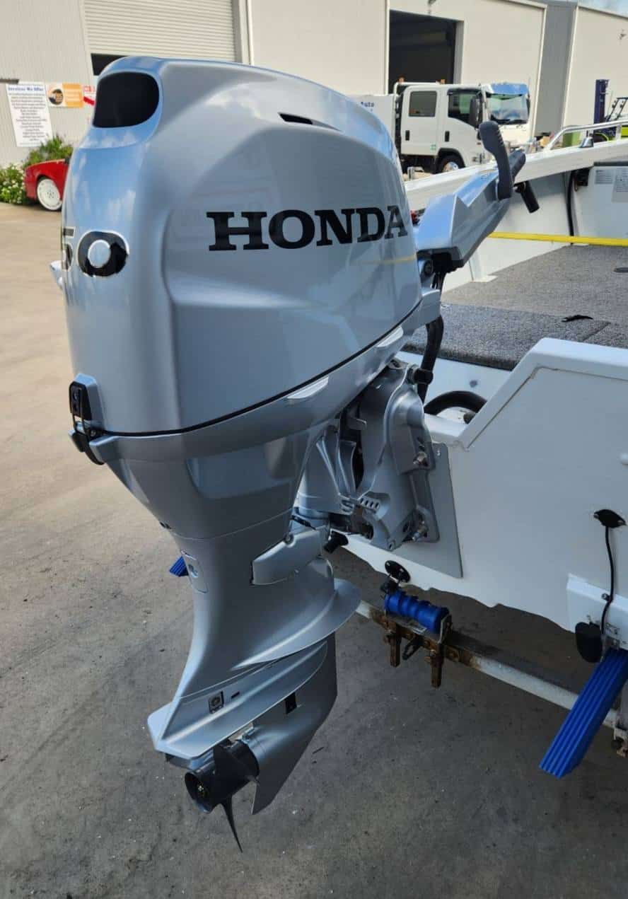A Honda Outboard Motor is Sitting on the Back of a Boat — Reef 2 River Marine in Proserpine, QLD