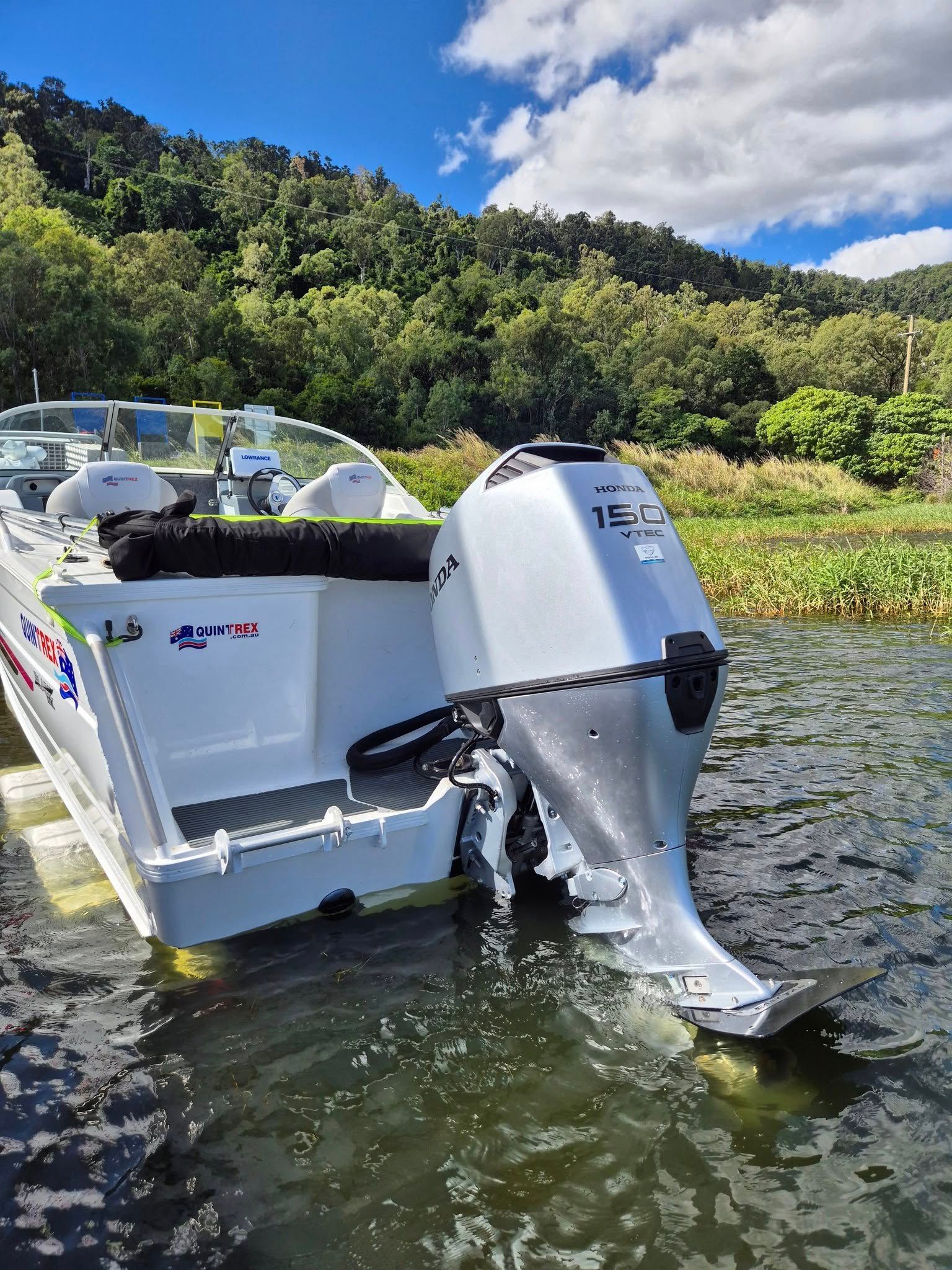 Boat With a Silver Outboard Motor on a Lake — Reef 2 River Marine in Proserpine, QLD
