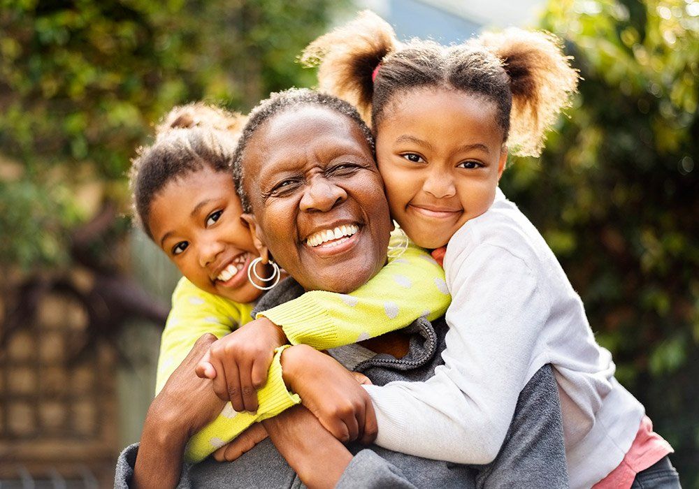 Two Kids Hugging Woman — Milwaukee, WI — The Parenting Network