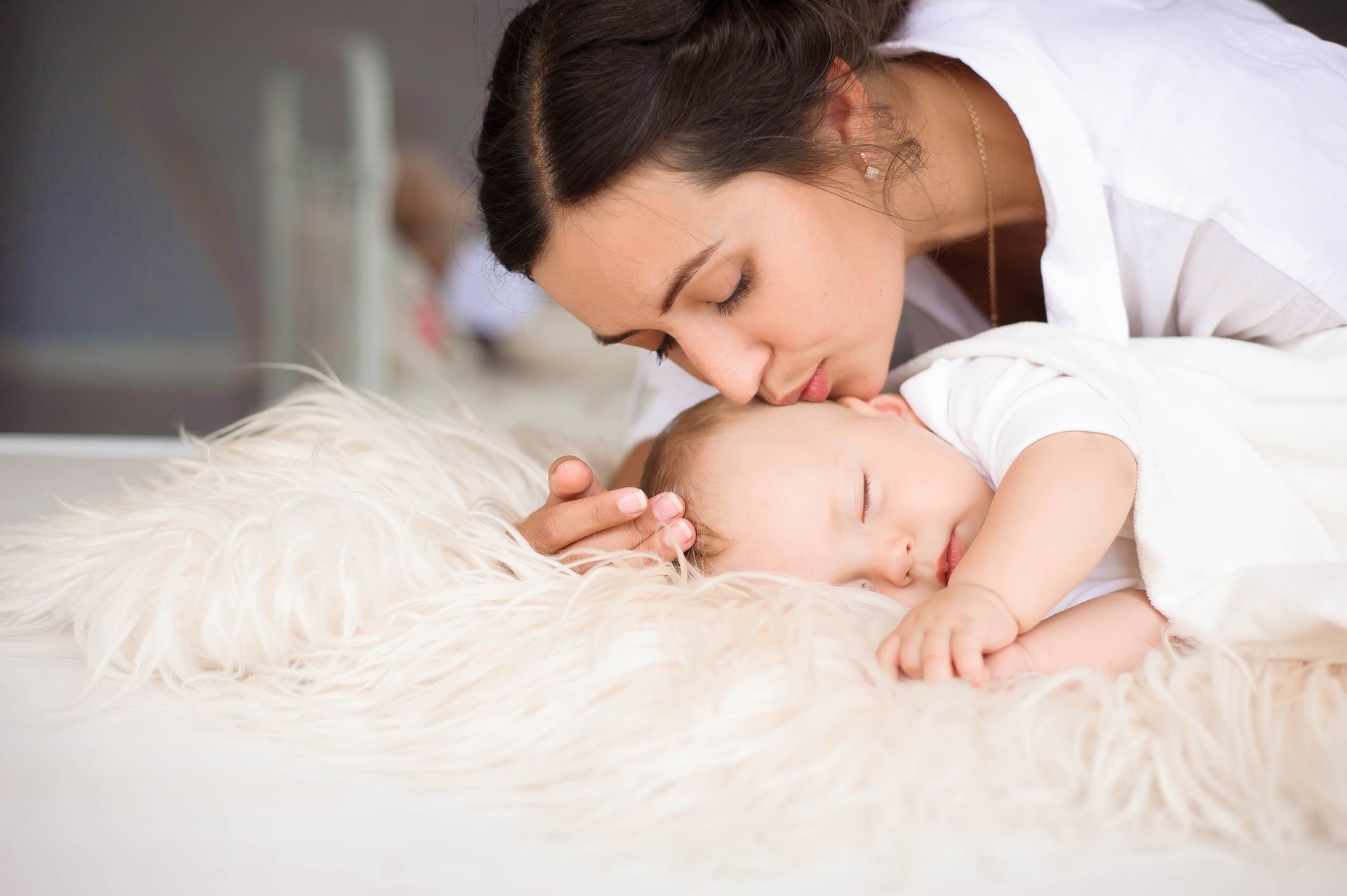 Mother kissing the baby — Milwaukee, WI — The Parenting Network