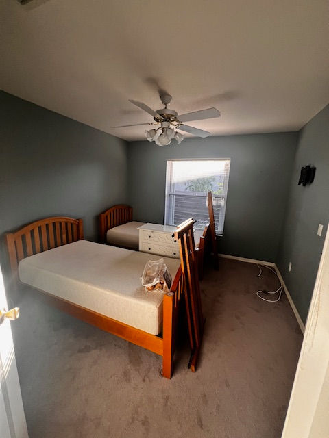 Interior view: entryway with doors leading to rooms; white walls, tile floor.