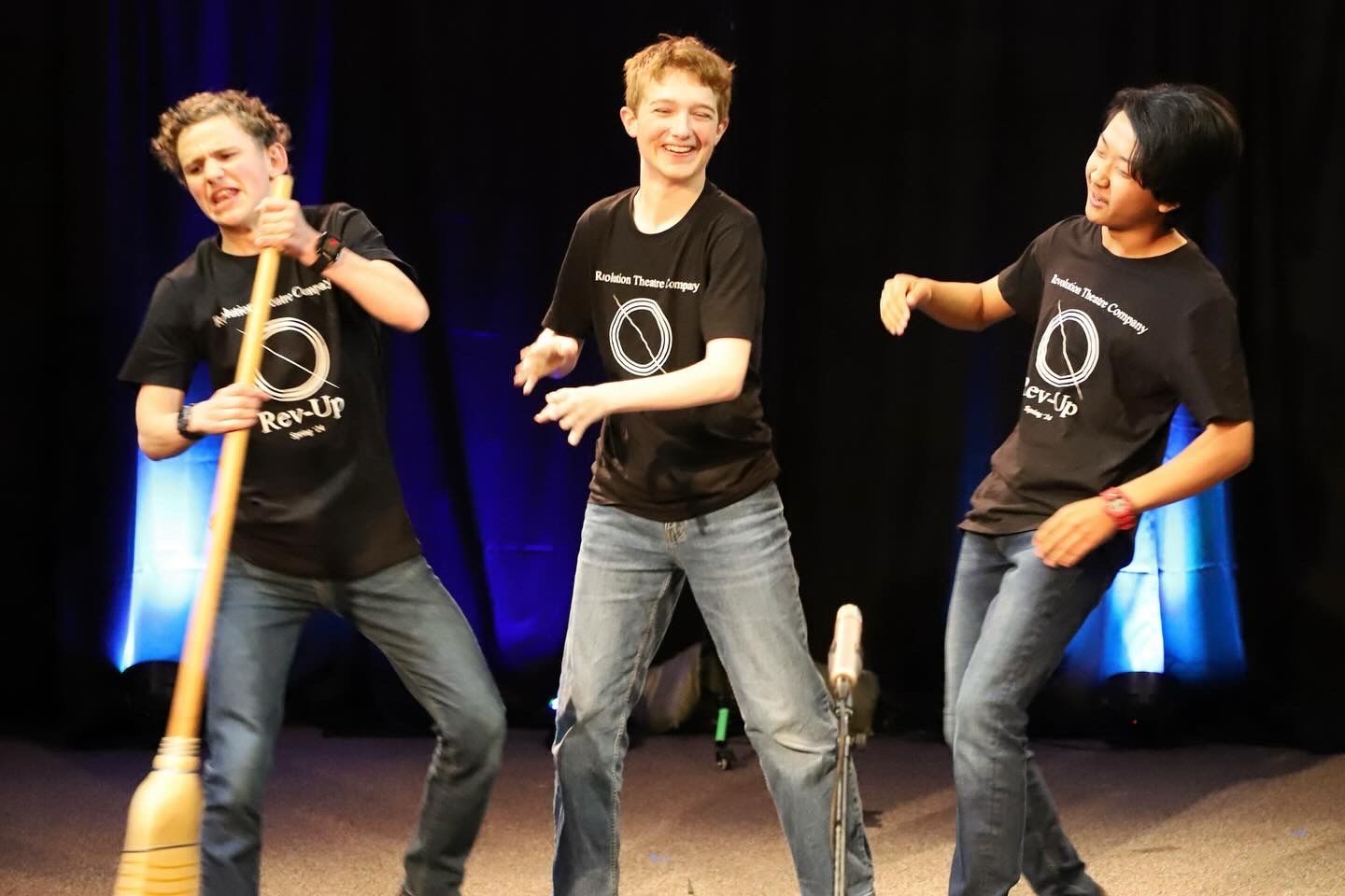Three young men wearing black shirts with the number 5 on them