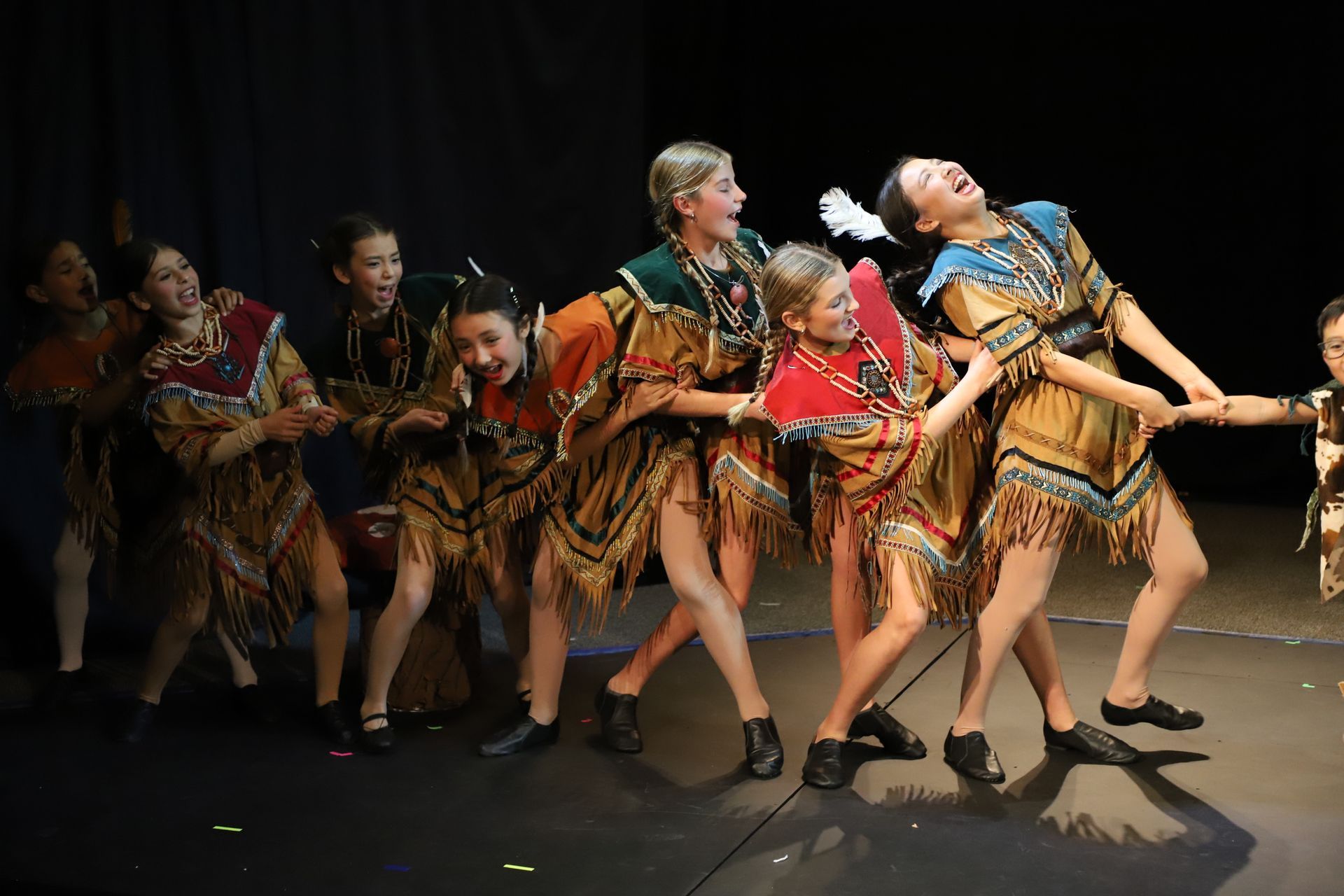 A group of children playing tug-of-war