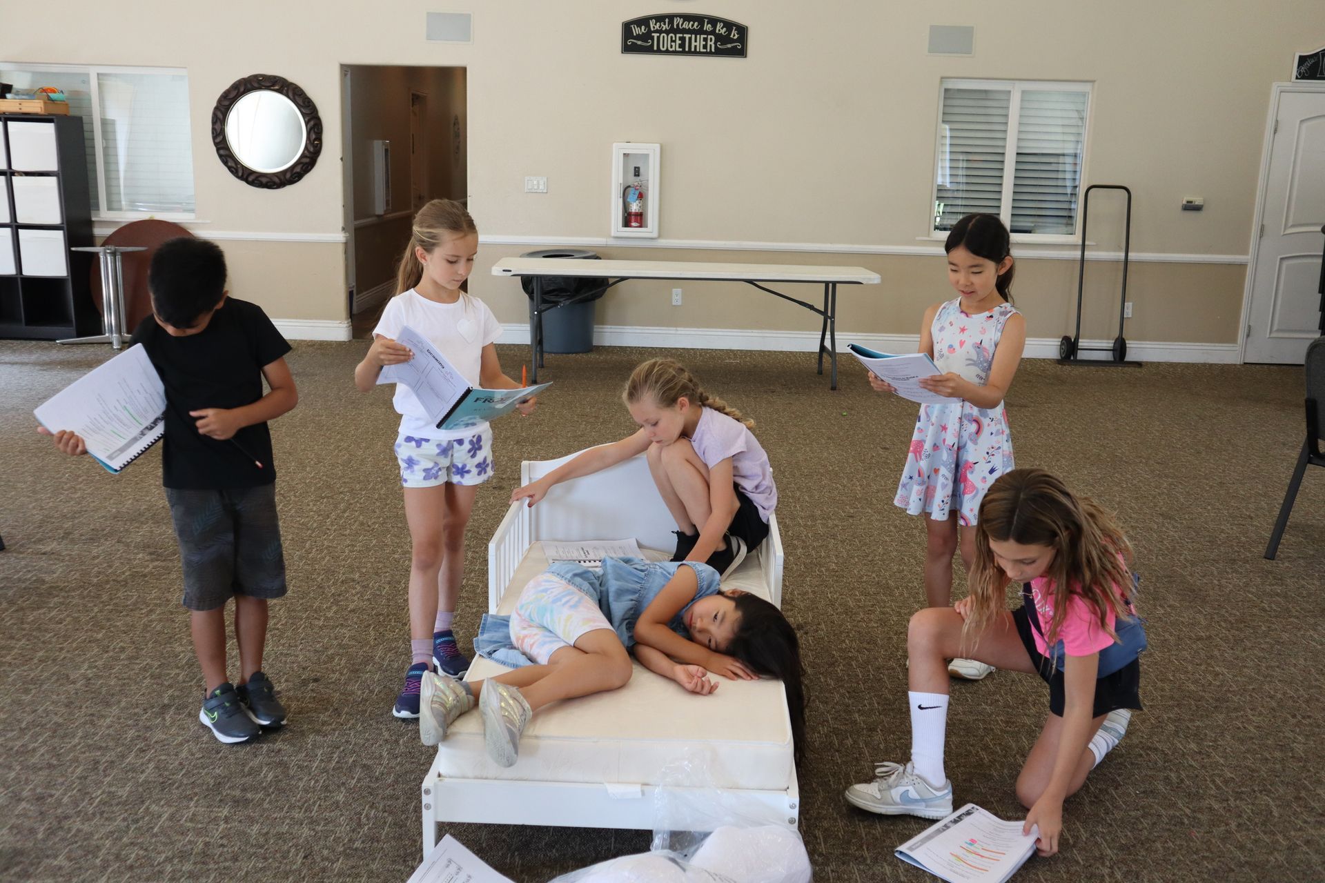 A group of children are playing a game in a room.