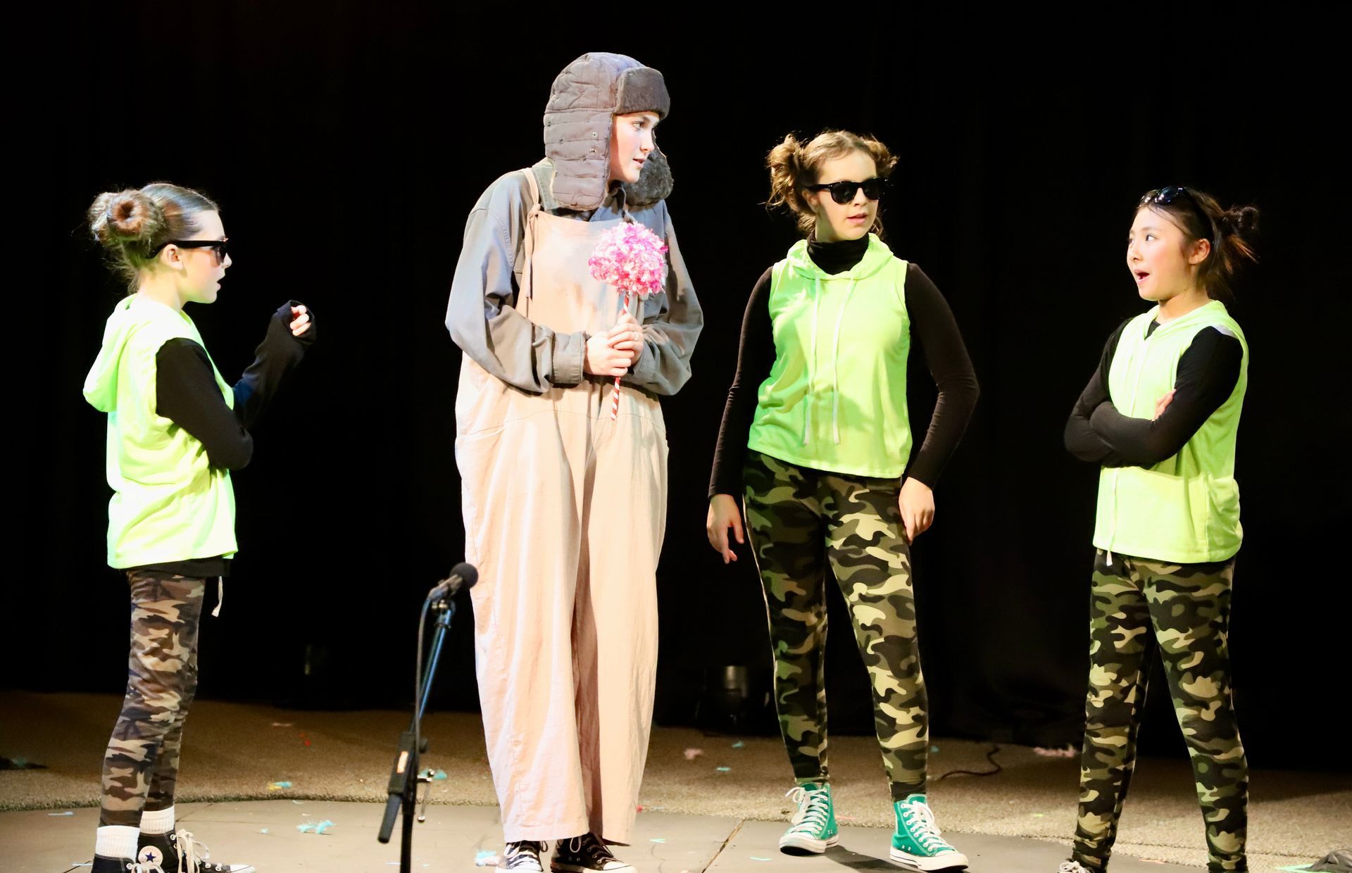 A group of people are standing next to each other on a stage.