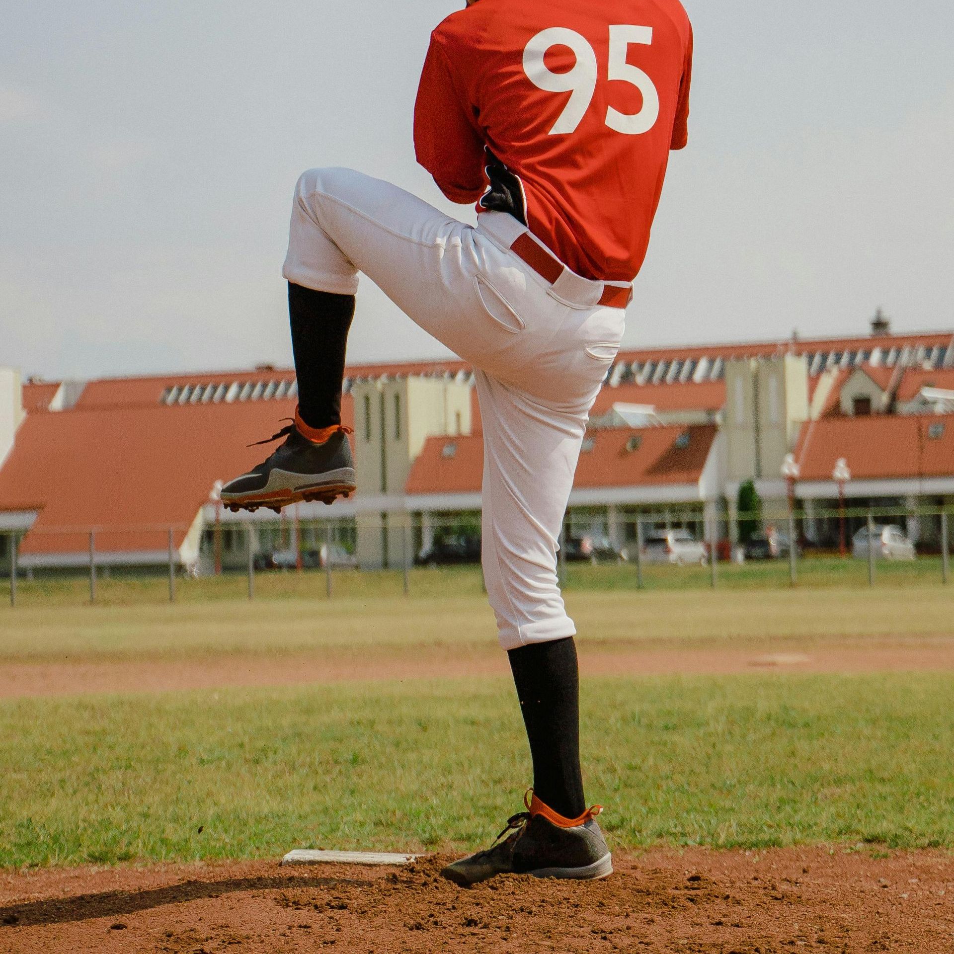 A baseball player with the number 95 on the back of his jersey