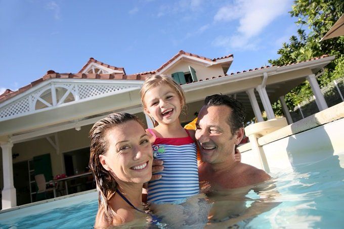 A Family Swimming in a Pool — Costa Mesa, CA — Secure One Capital