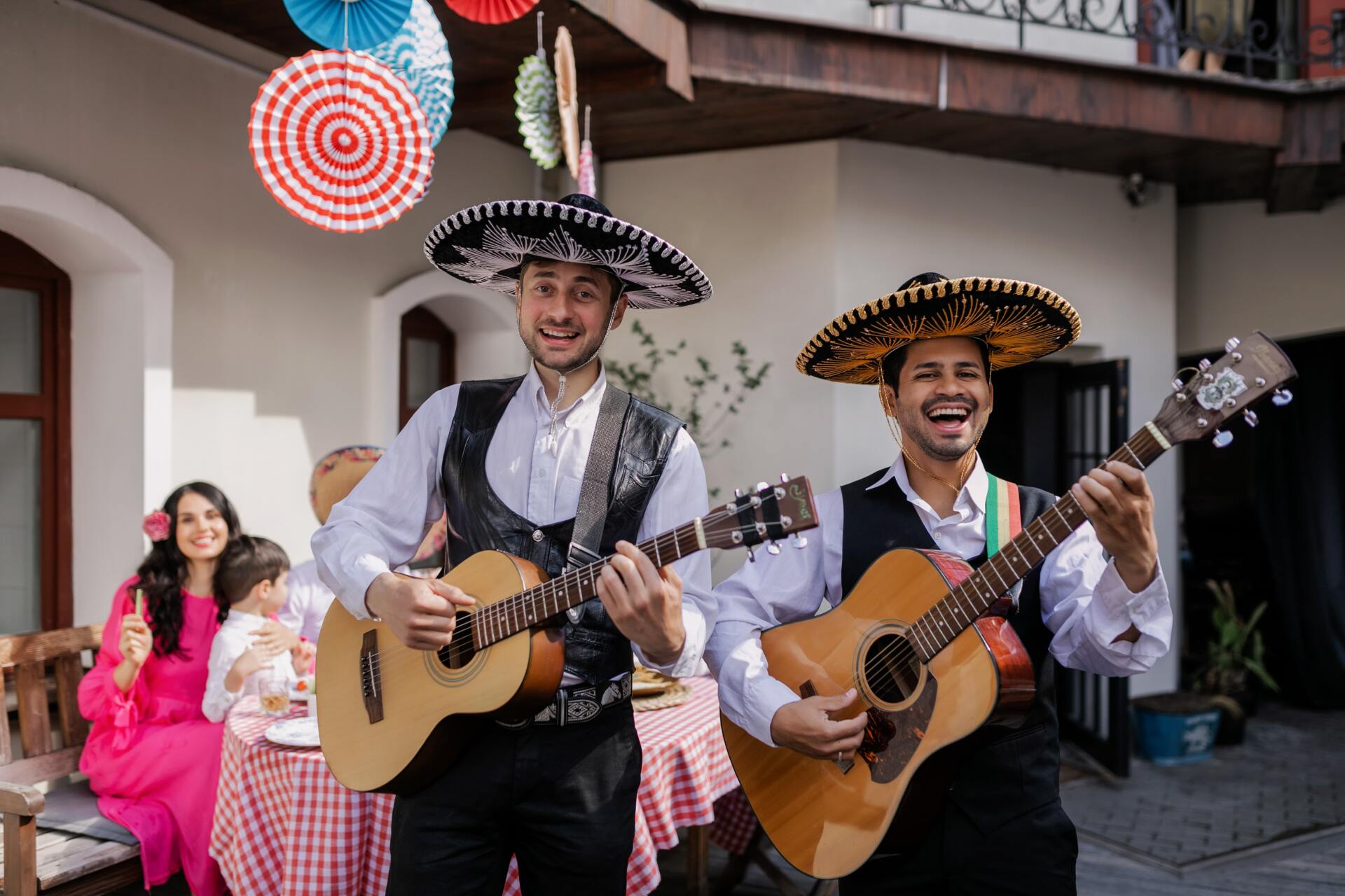 Mexican men singing and playing guitar