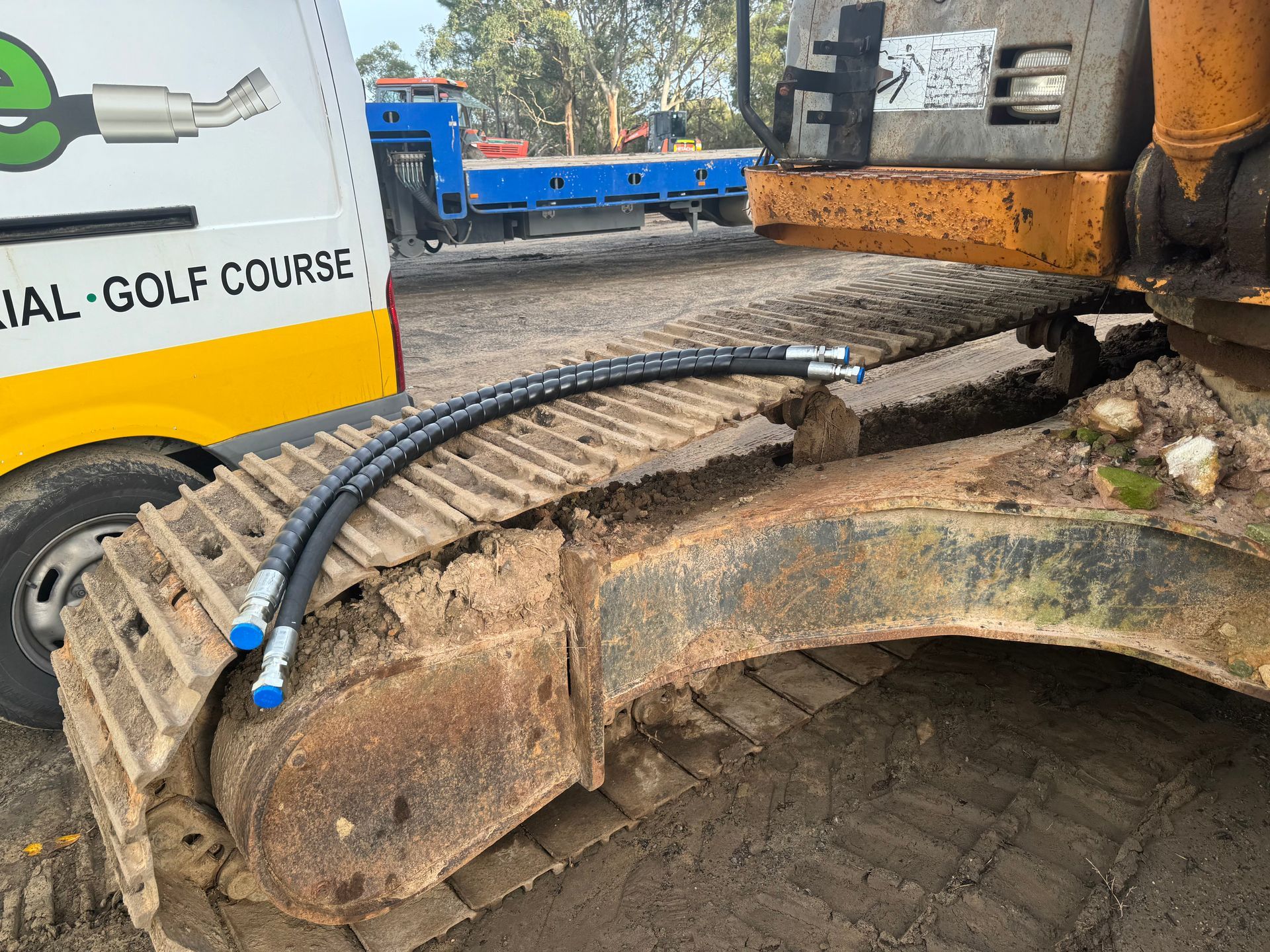A Close Up Of A Yellow Hydraulic Cylinder With Hose Attached To It — Hosemobile In Wyong, NSW