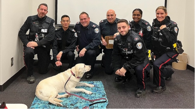 Group of Officers with Dandy the Trauma Dog