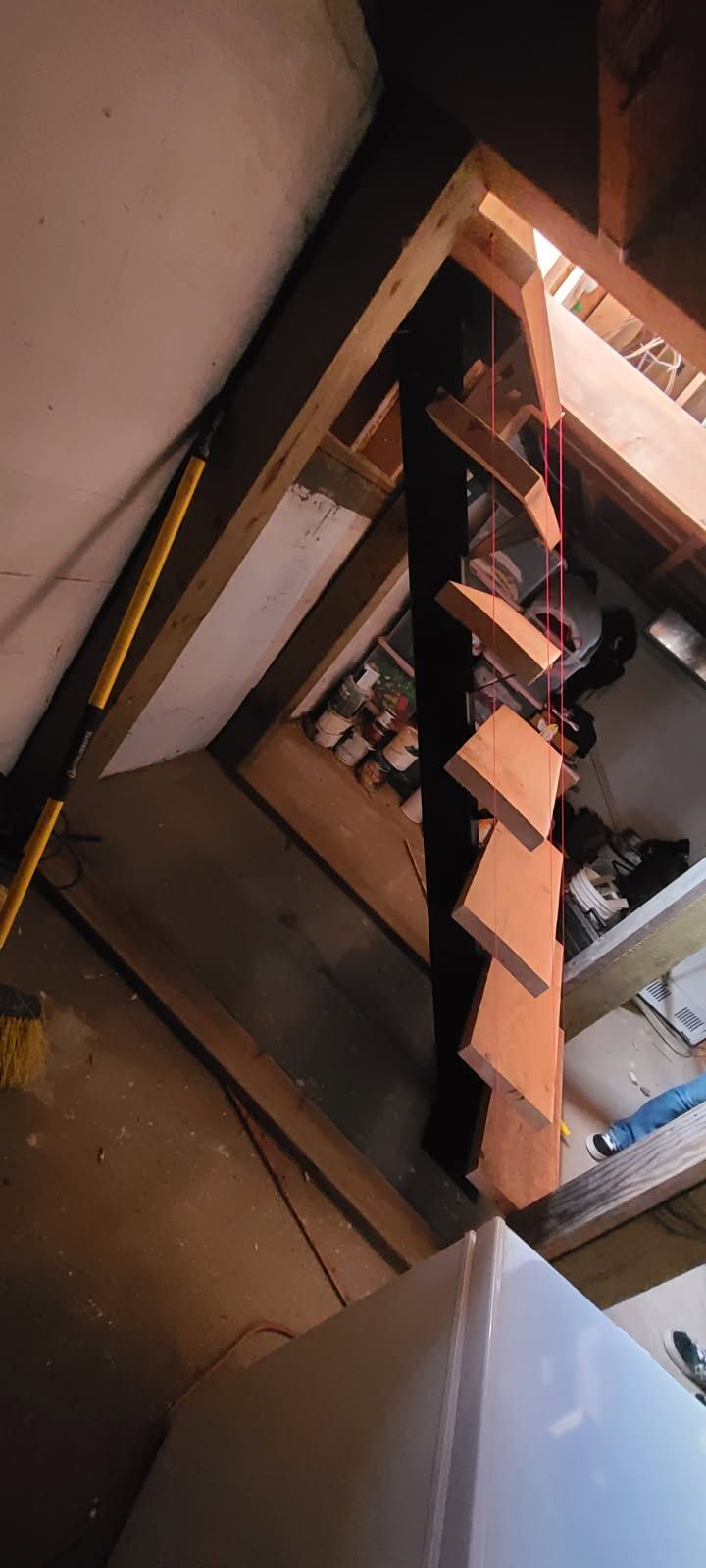 A staircase is being built in an attic.