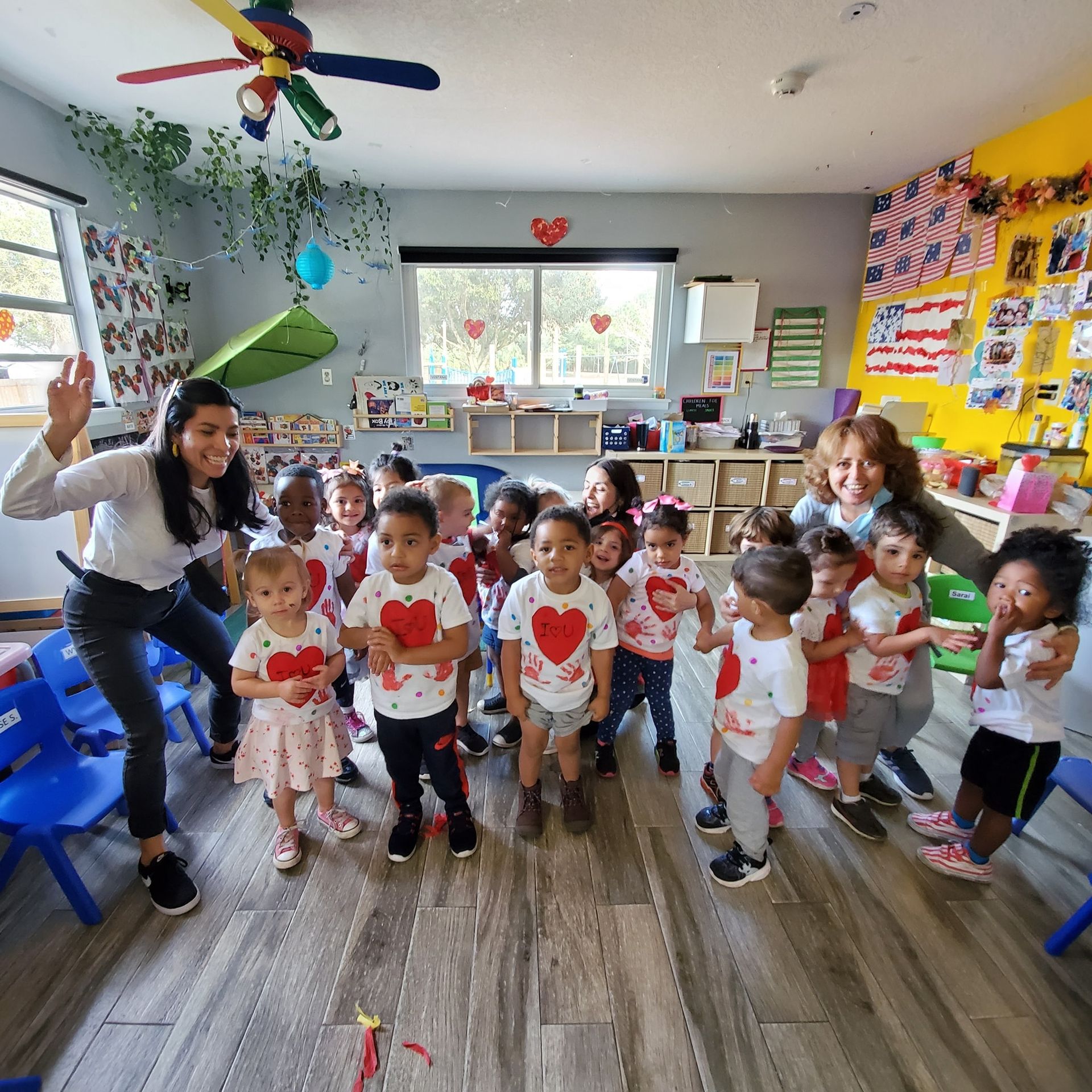 A group of children are posing for a picture in a classroom.
