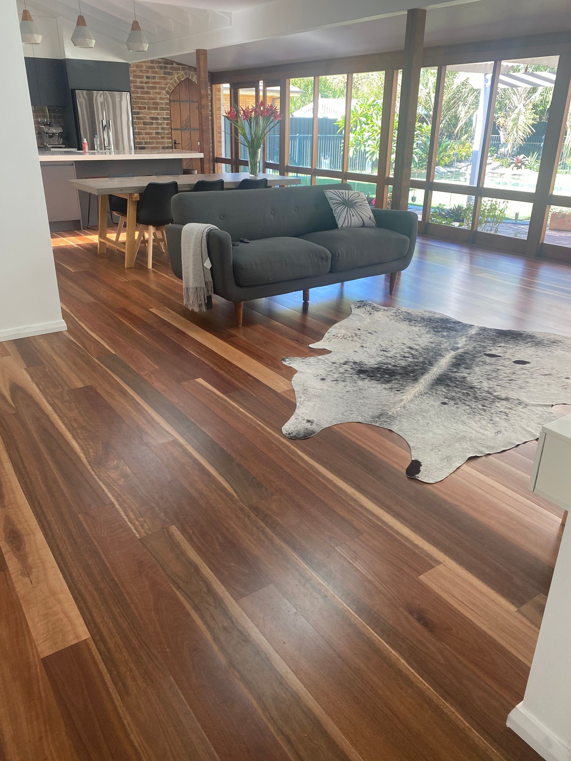 Wooden floor with carpet and sofa chair