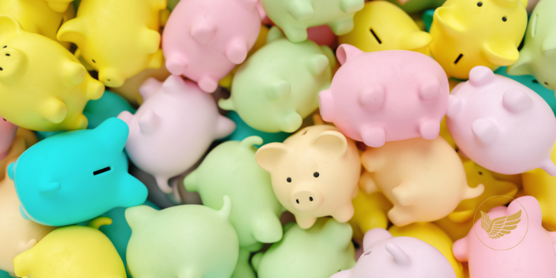 A pile of colorful pigs are sitting on top of each other on a table.