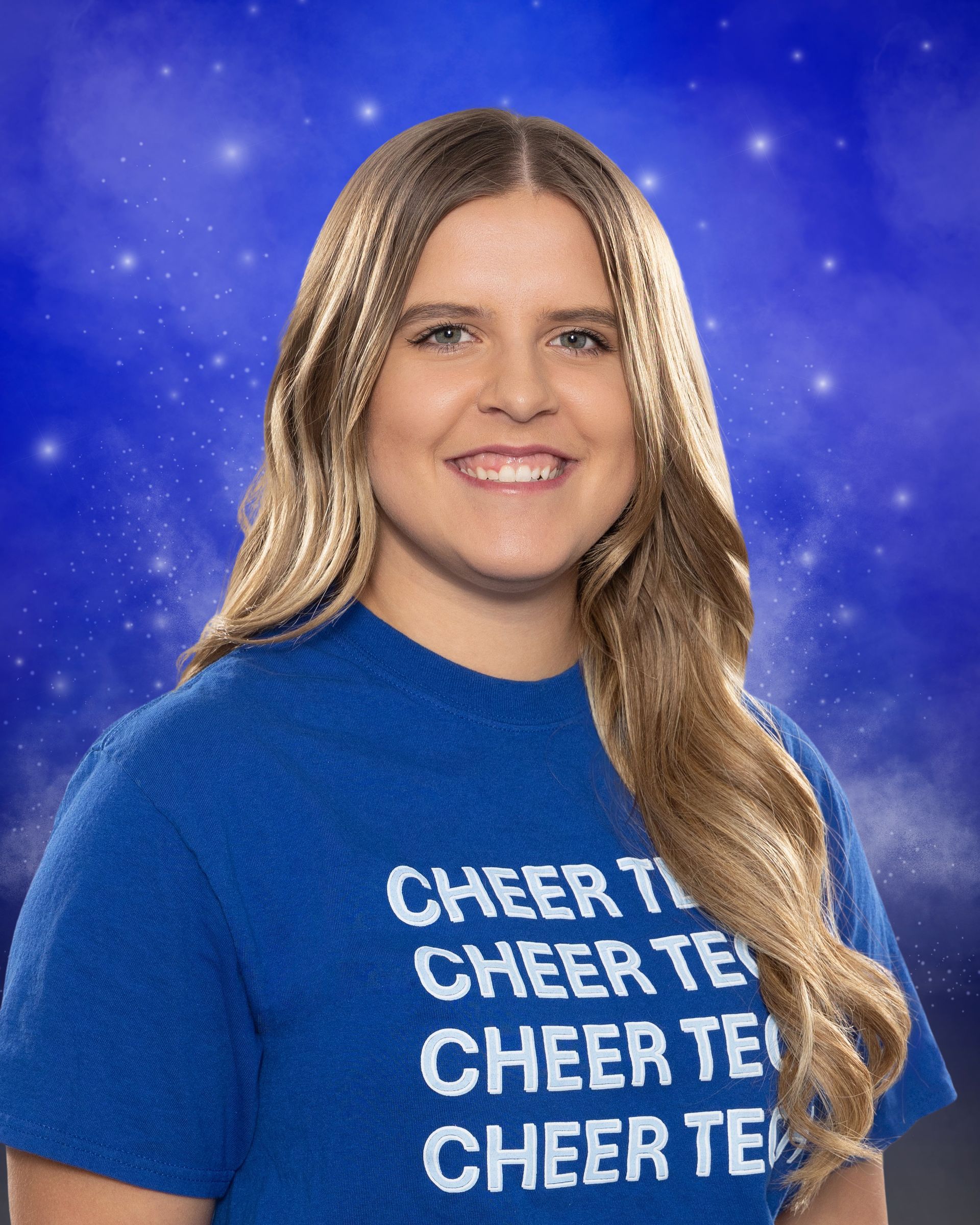 A woman wearing a blue shirt that says cheer on it