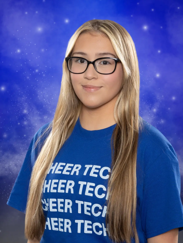 A girl wearing glasses and a blue shirt that says heer tech
