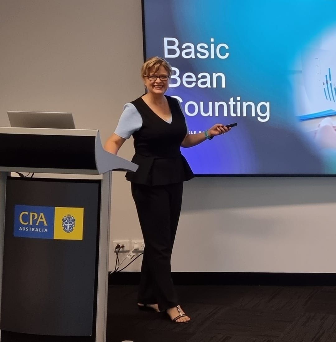 A Woman Presenting Basic Bean Counting on a Screen  — Adding Value CFO Pty Ltd in Larrakeyah, NT