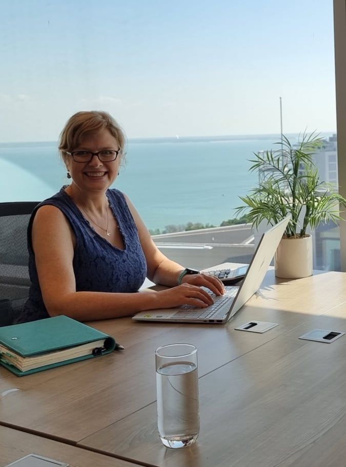 A Lady Is Sitting At A Desk With a Laptop  — Adding Value CFO Pty Ltd in Larrakeyah, NT