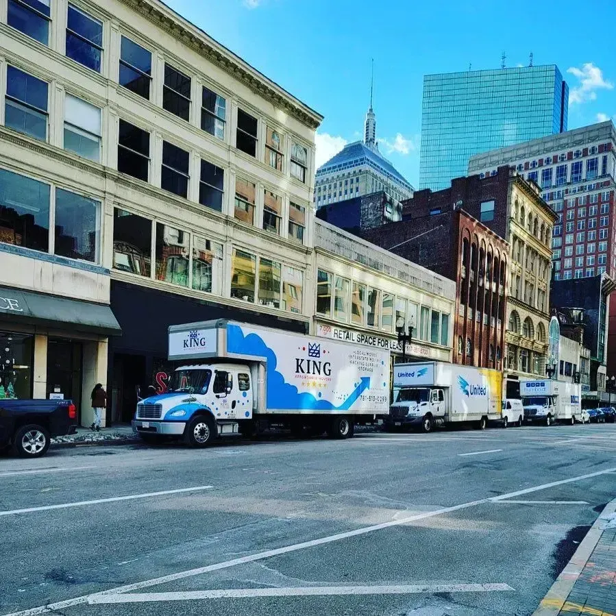 A king moving truck is parked on the side of the road