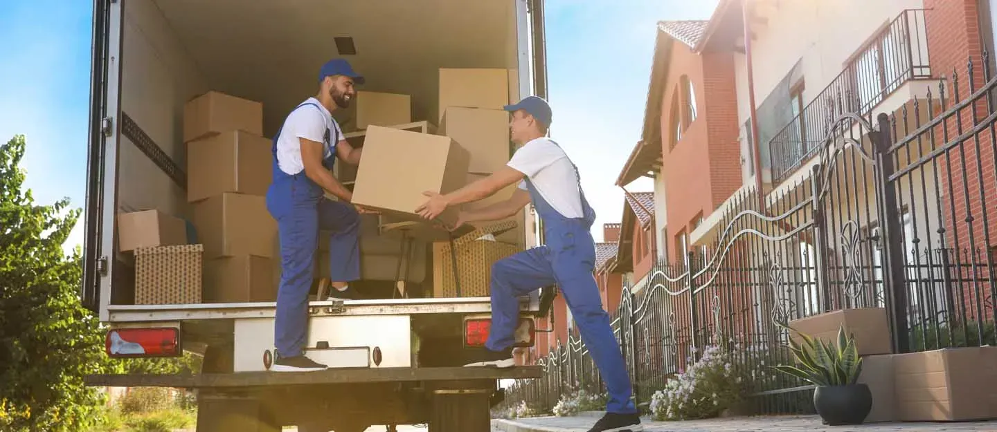 Movers packing furniture or setting up a new home or office.